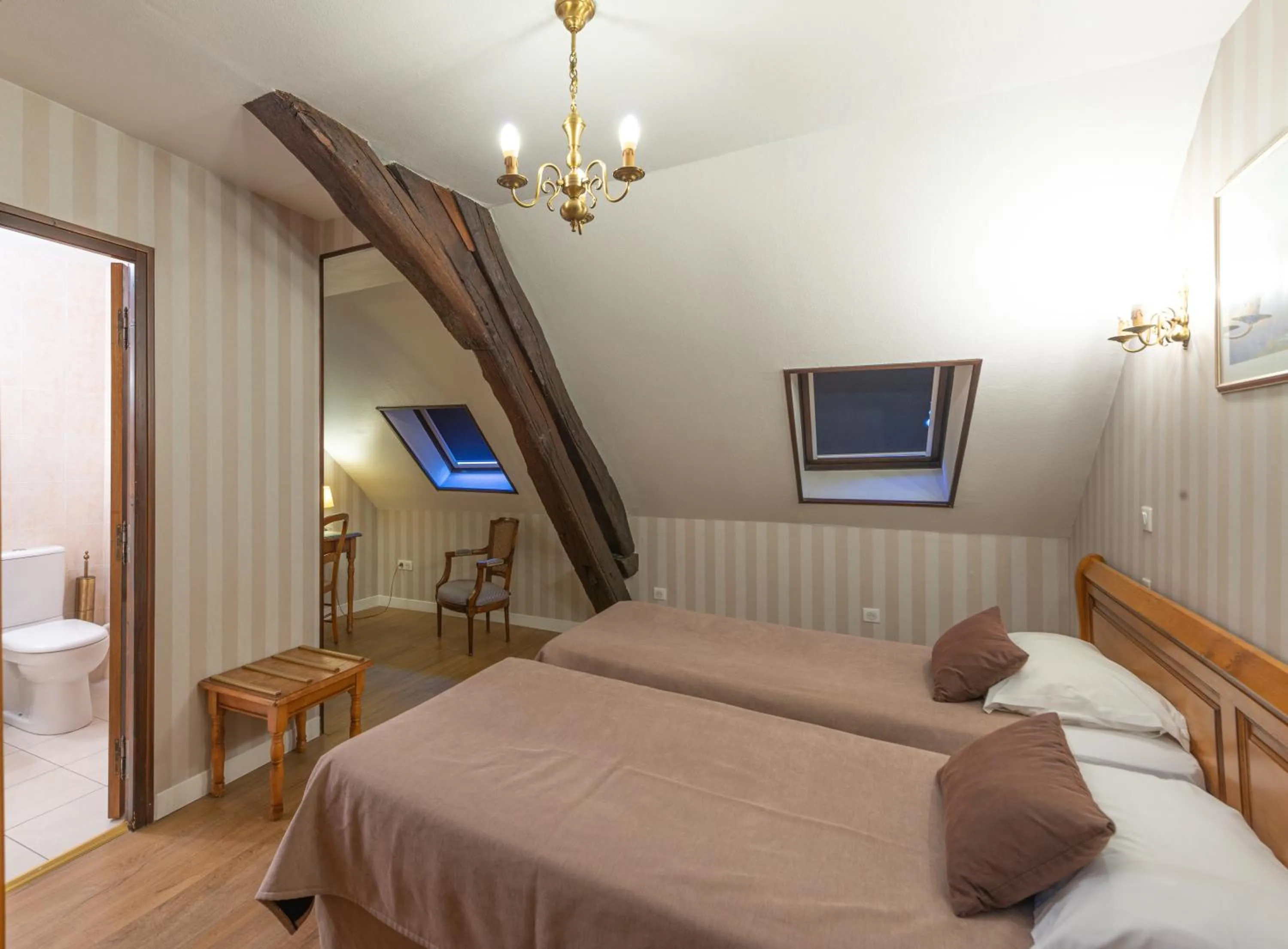 Photo of the whole room, Bed in Logis Hotel de La Cloche