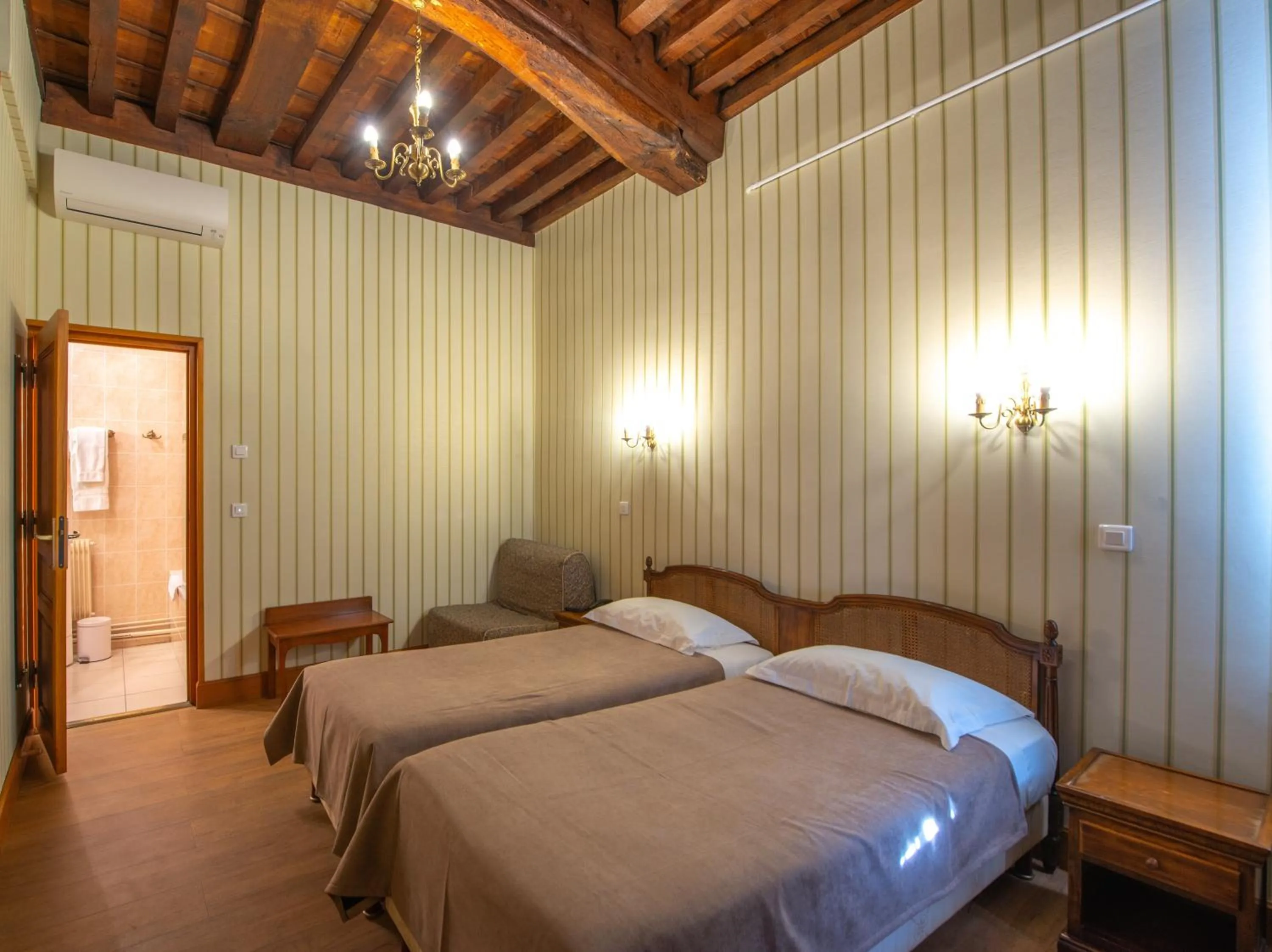 Photo of the whole room, Bed in Logis Hotel de La Cloche
