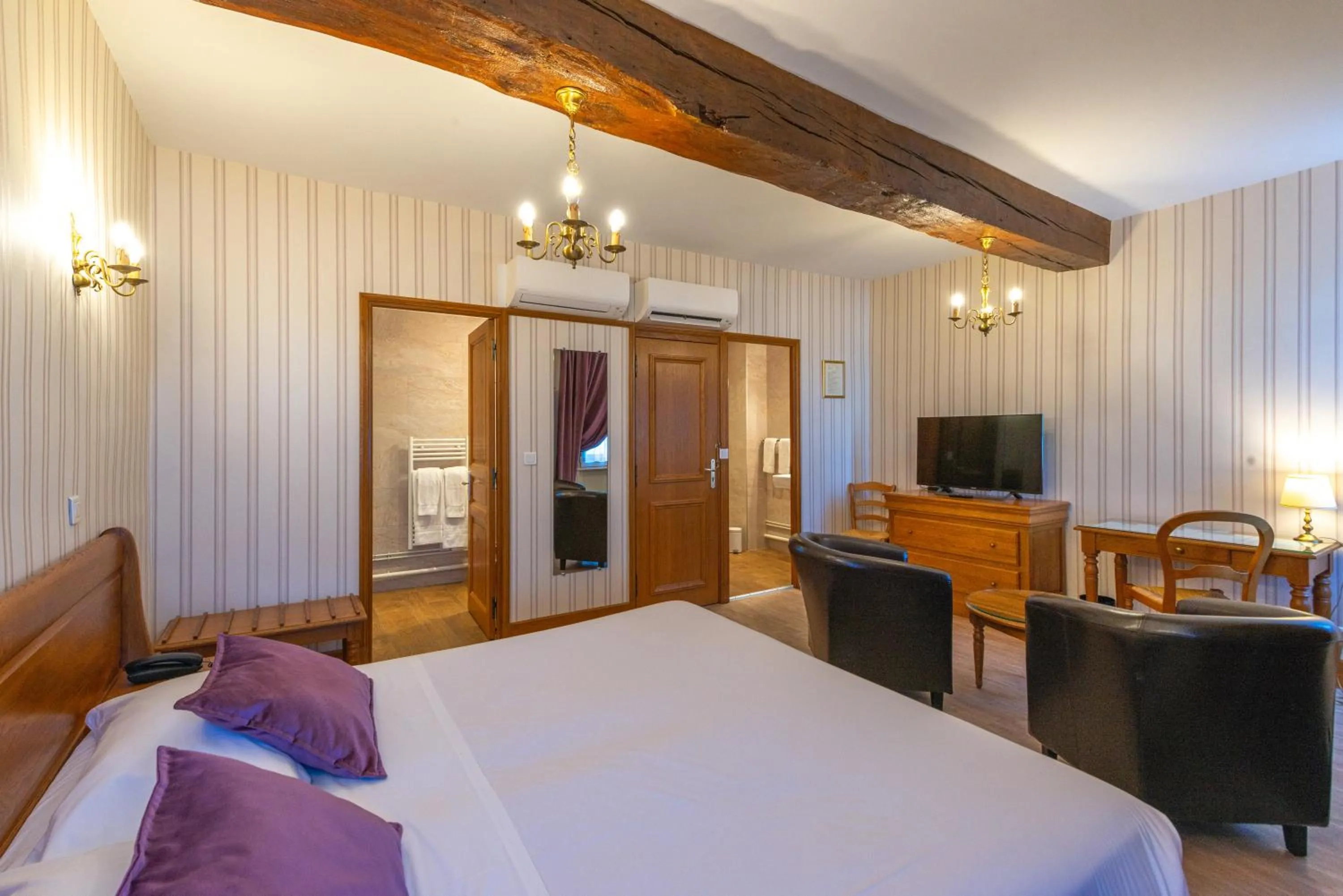 Photo of the whole room, Bed in Logis Hotel de La Cloche