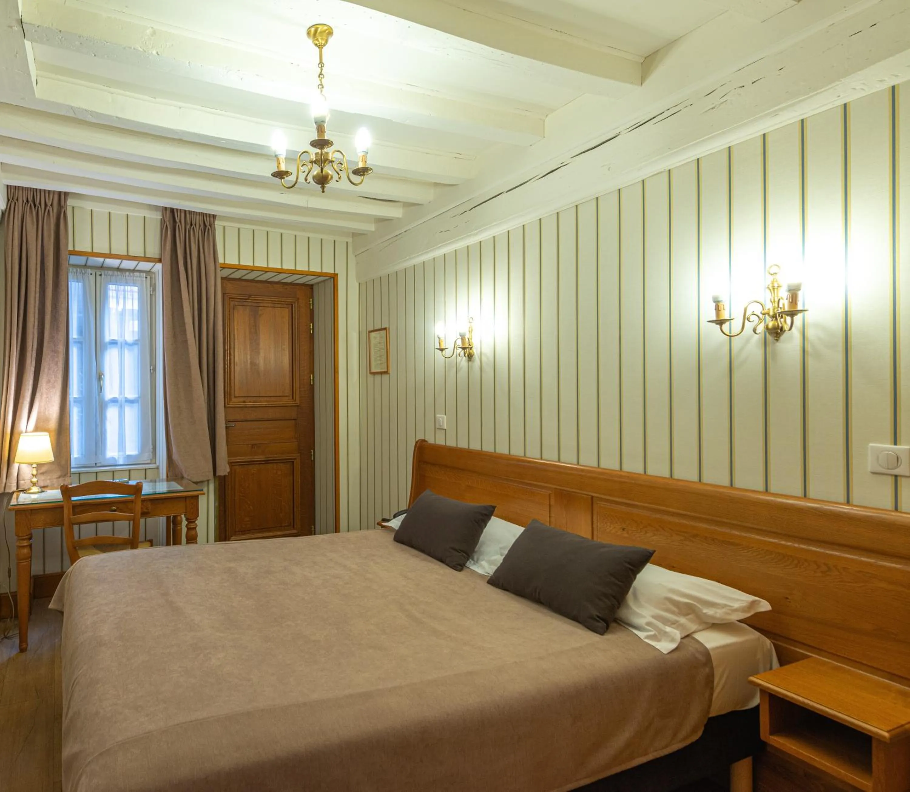 Photo of the whole room, Bed in Logis Hotel de La Cloche