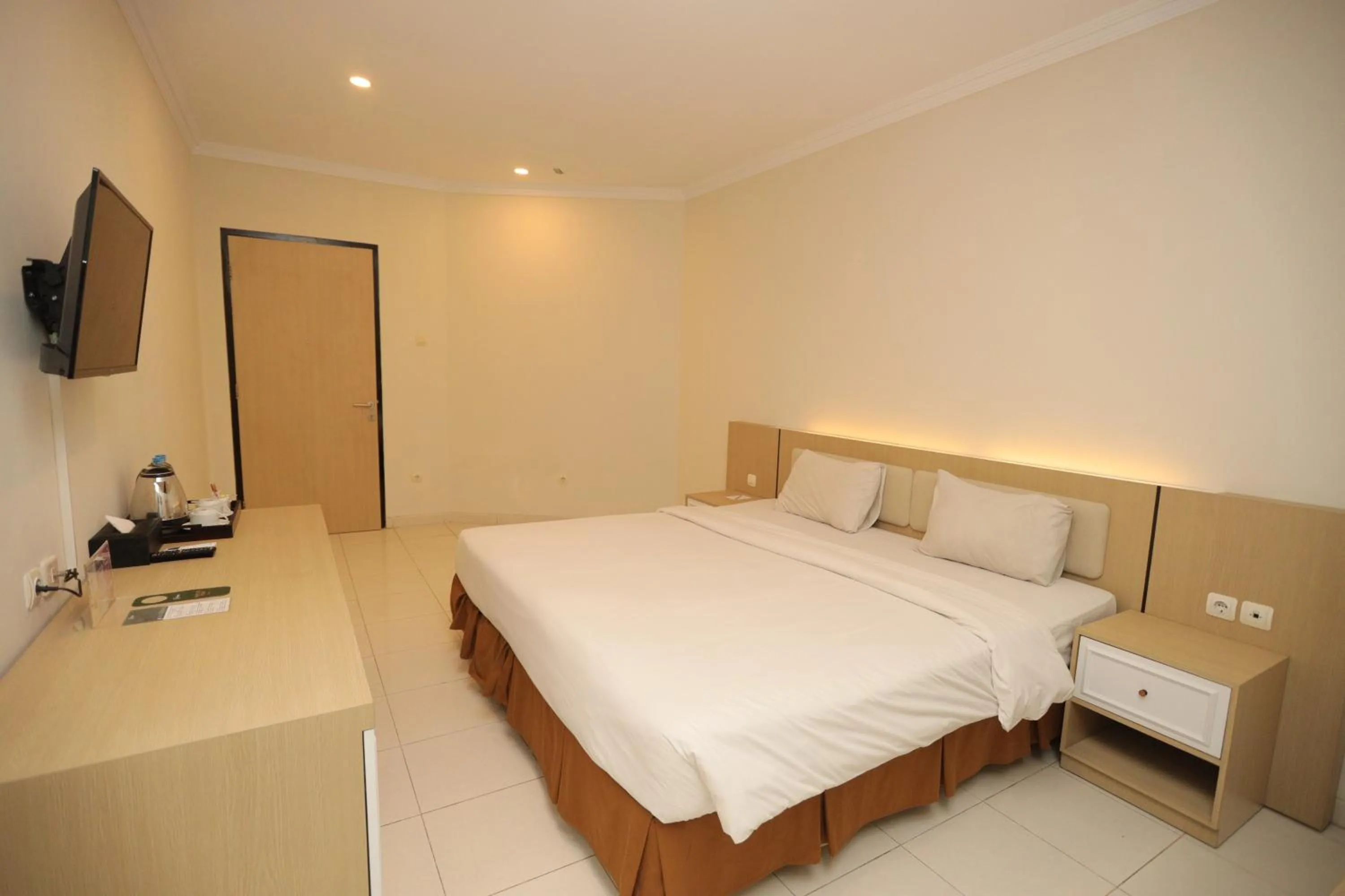 Bed in LPP Garden Hotel