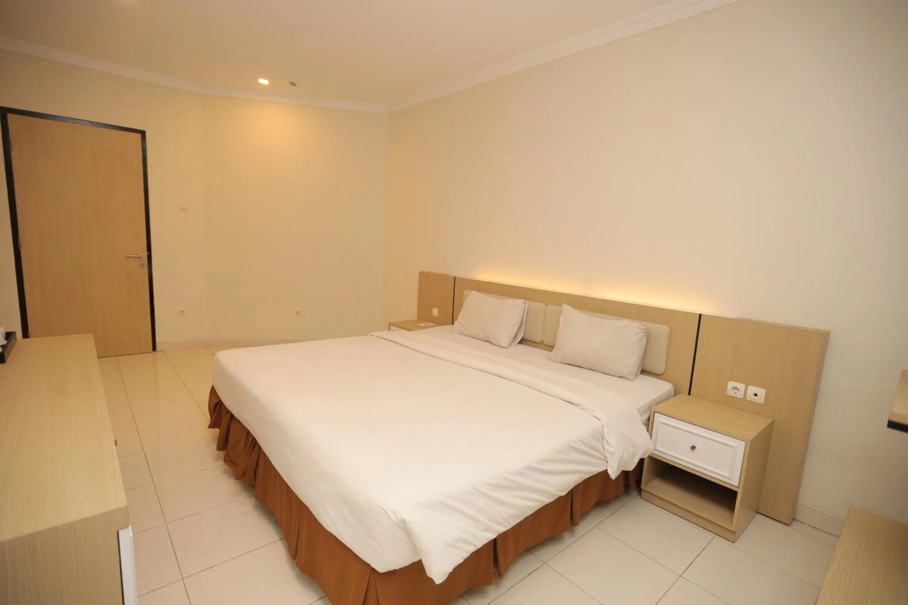 Bed in LPP Garden Hotel