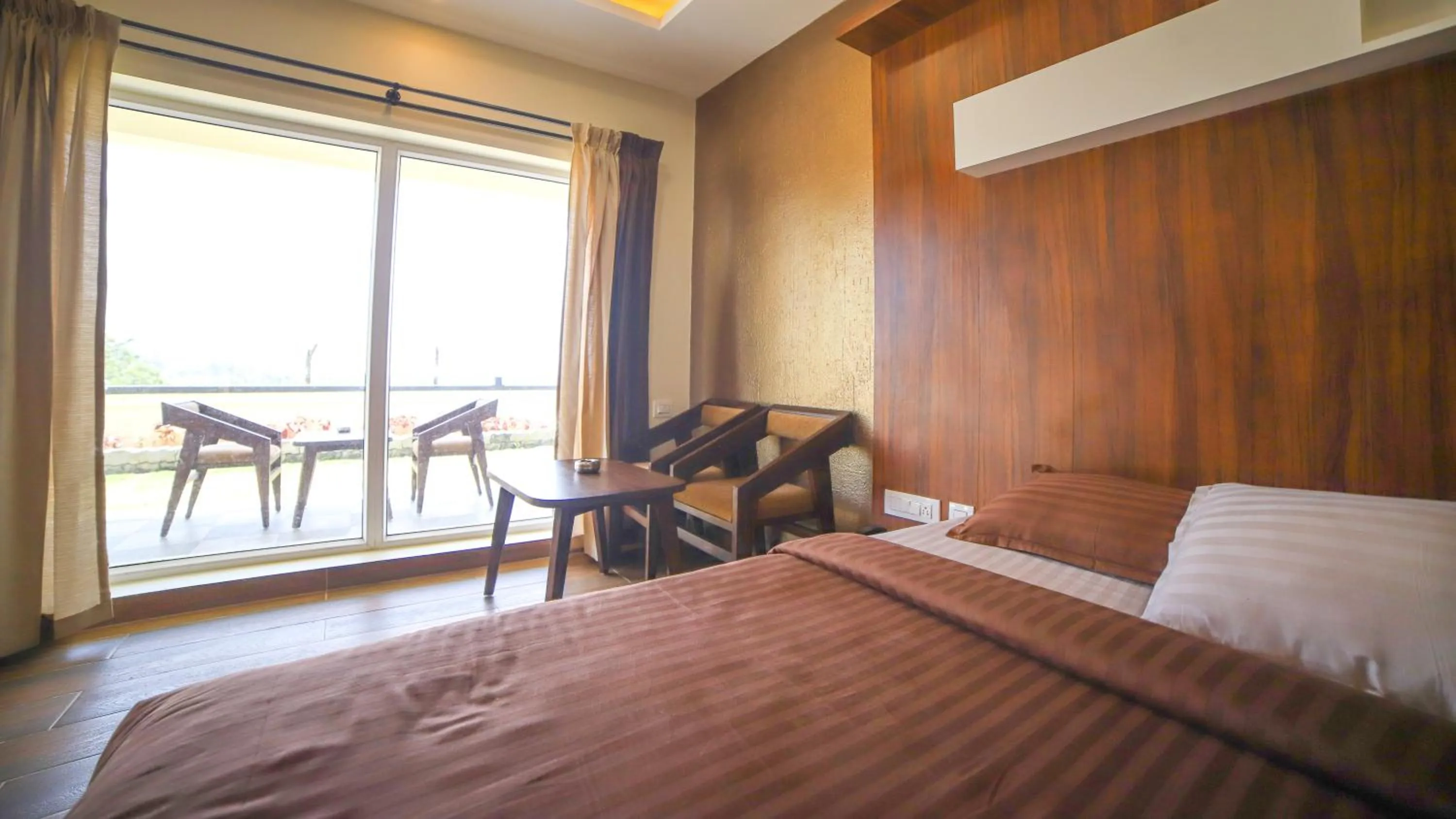 Bed in Aira Residency Kothagiri by Lexstays