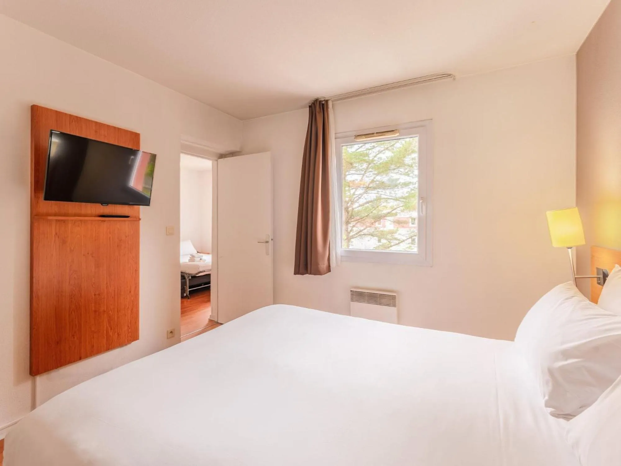 Bedroom, Bed in Séjours & Affaires Nantes La Beaujoire