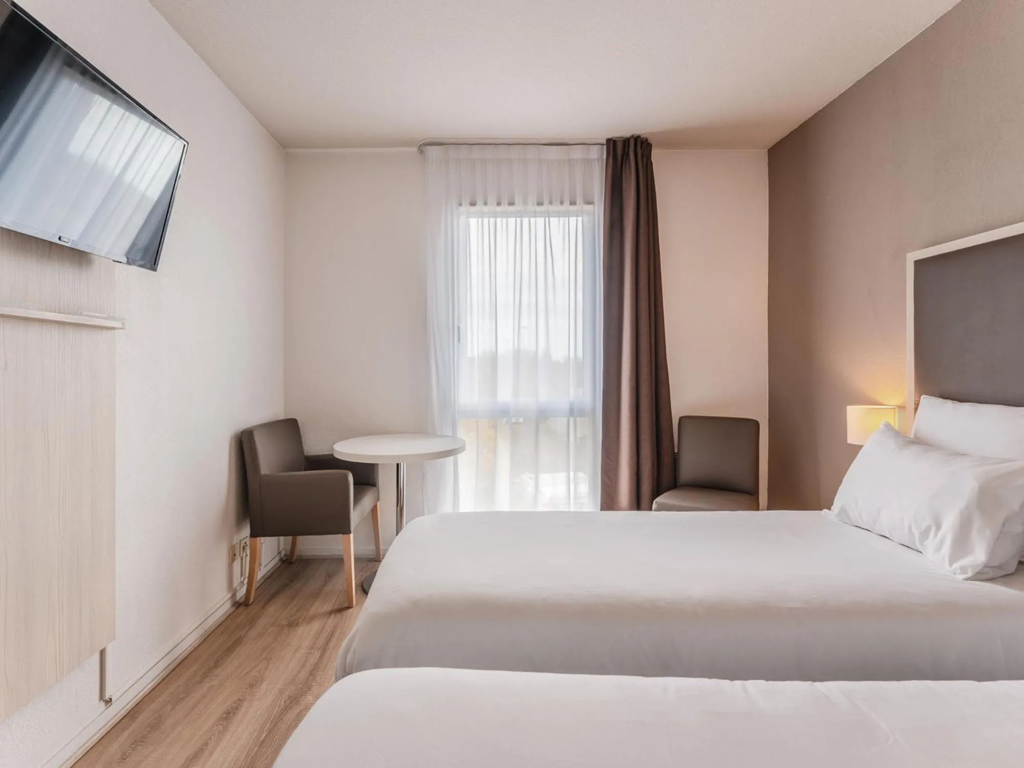 Bedroom, Bed in Séjours & Affaires Nantes La Beaujoire