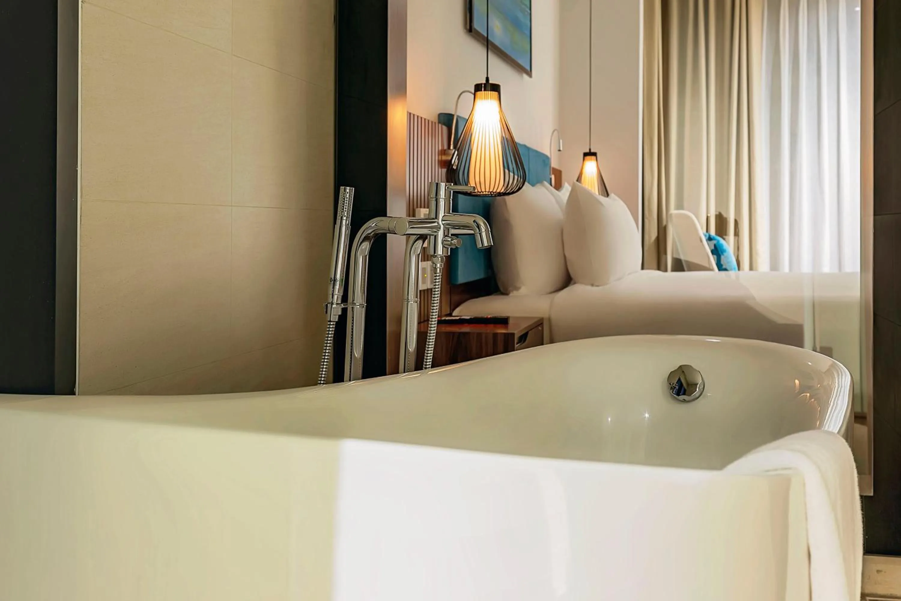 Bathroom, Bed in Maximilan Danang Beach Hotel