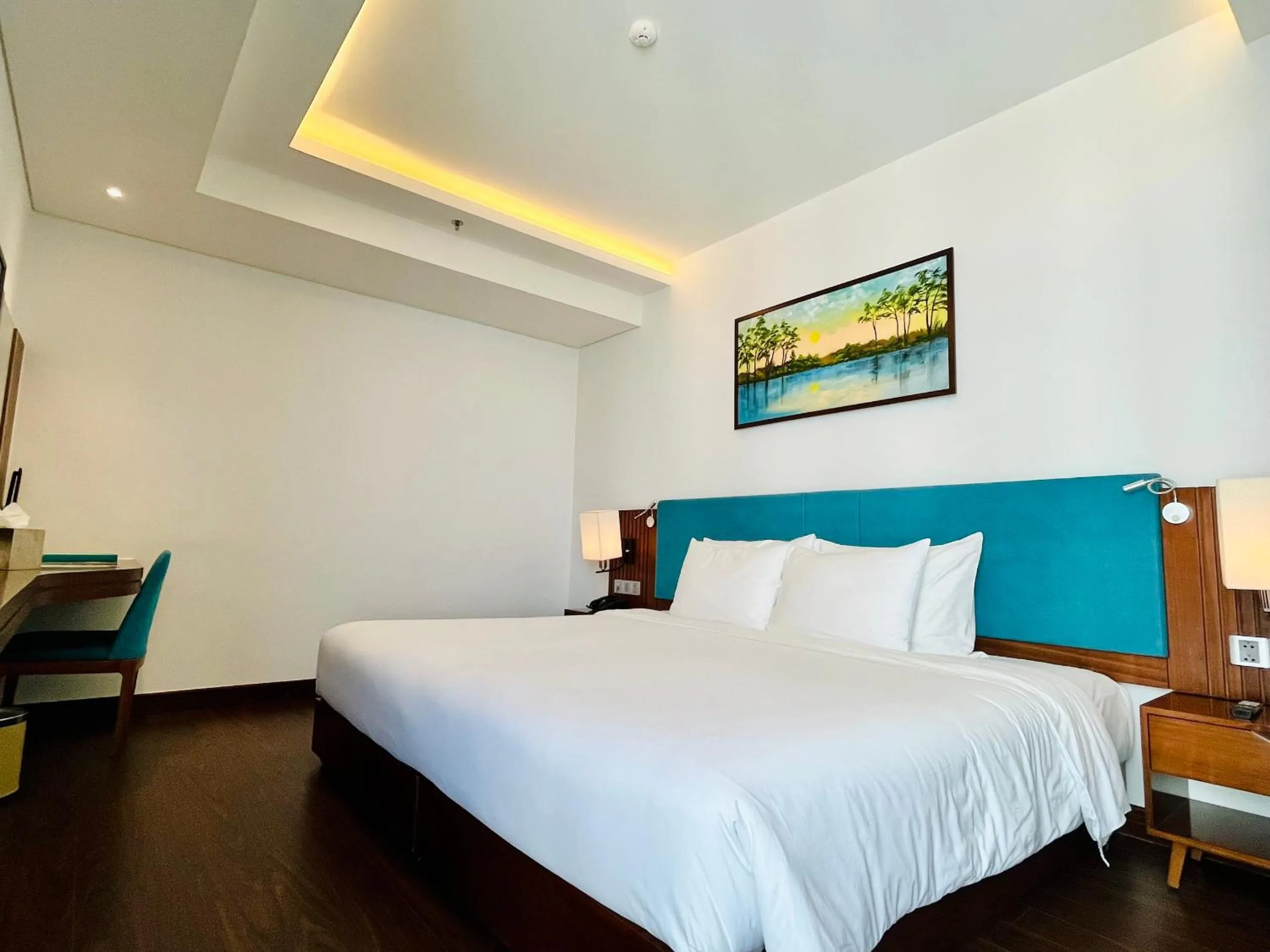 Bed in Maximilan Danang Beach Hotel