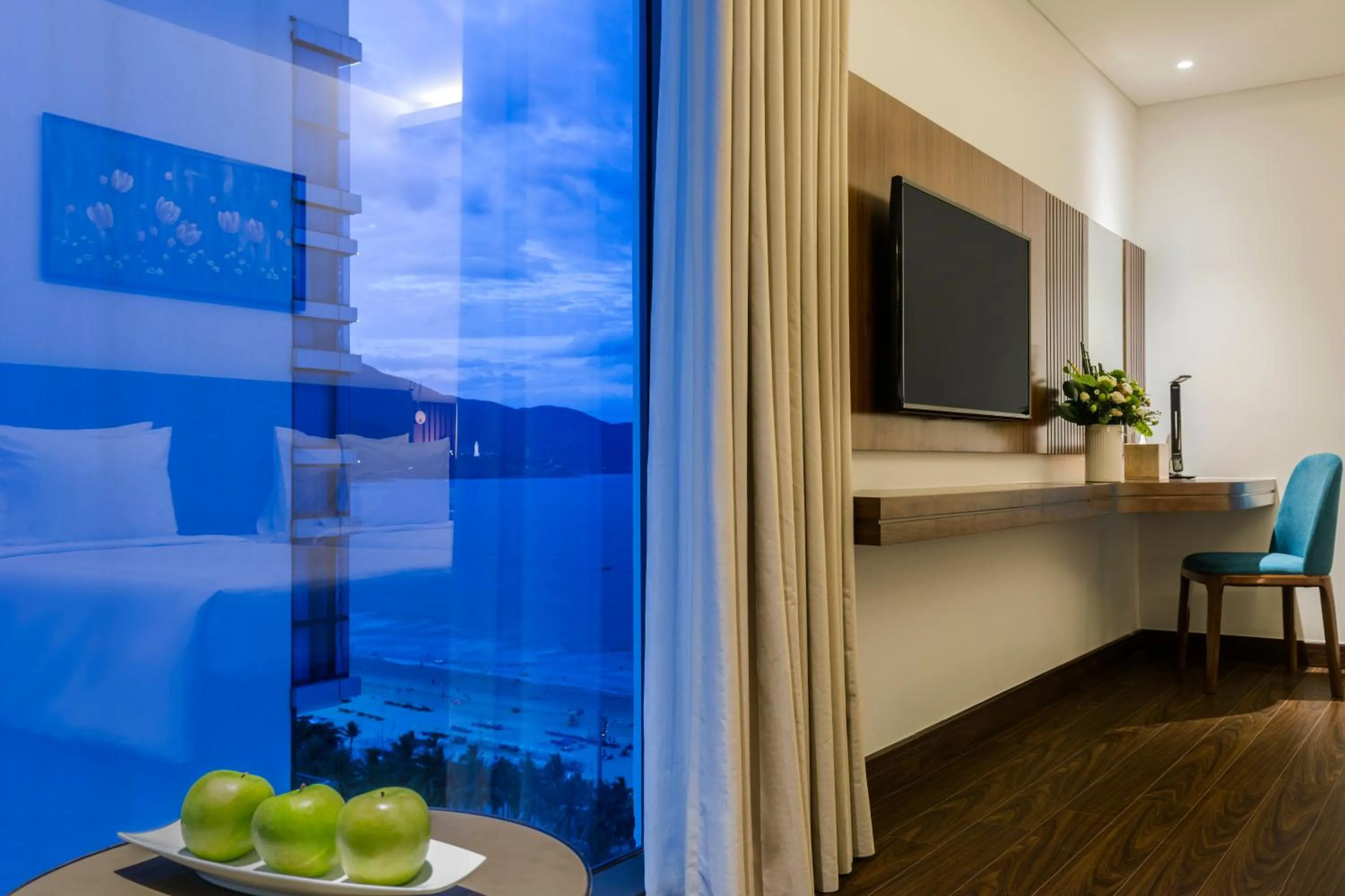 Bed in Maximilan Danang Beach Hotel