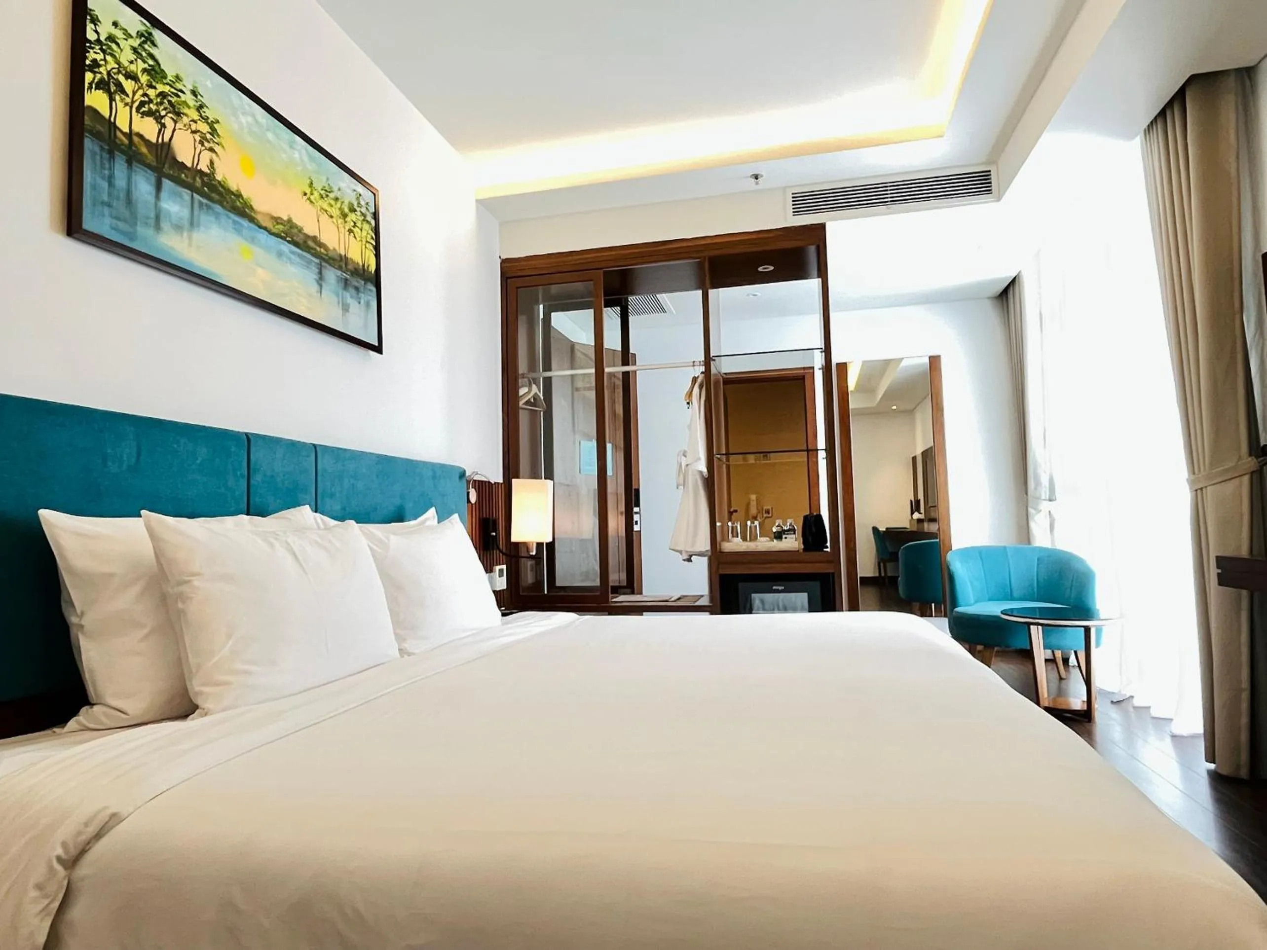 Bed in Maximilan Danang Beach Hotel