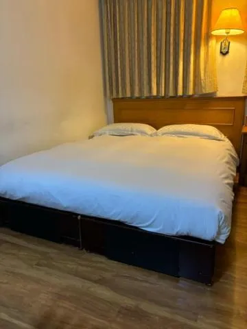 Bed in 金馬大飯店 Riverside Hotel