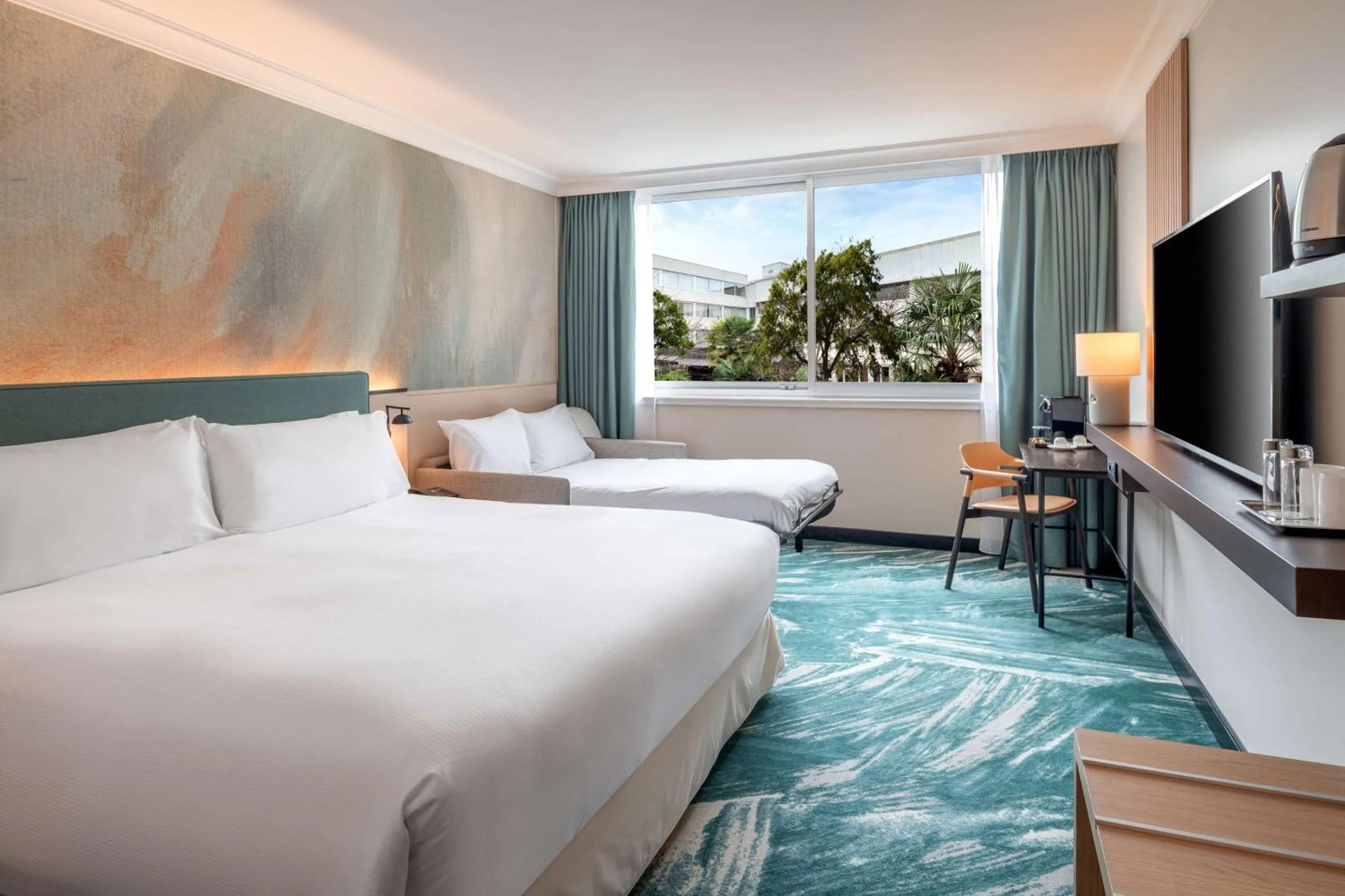 Communal lounge/ TV room, Bed in DoubleTree by Hilton Paris Bougival