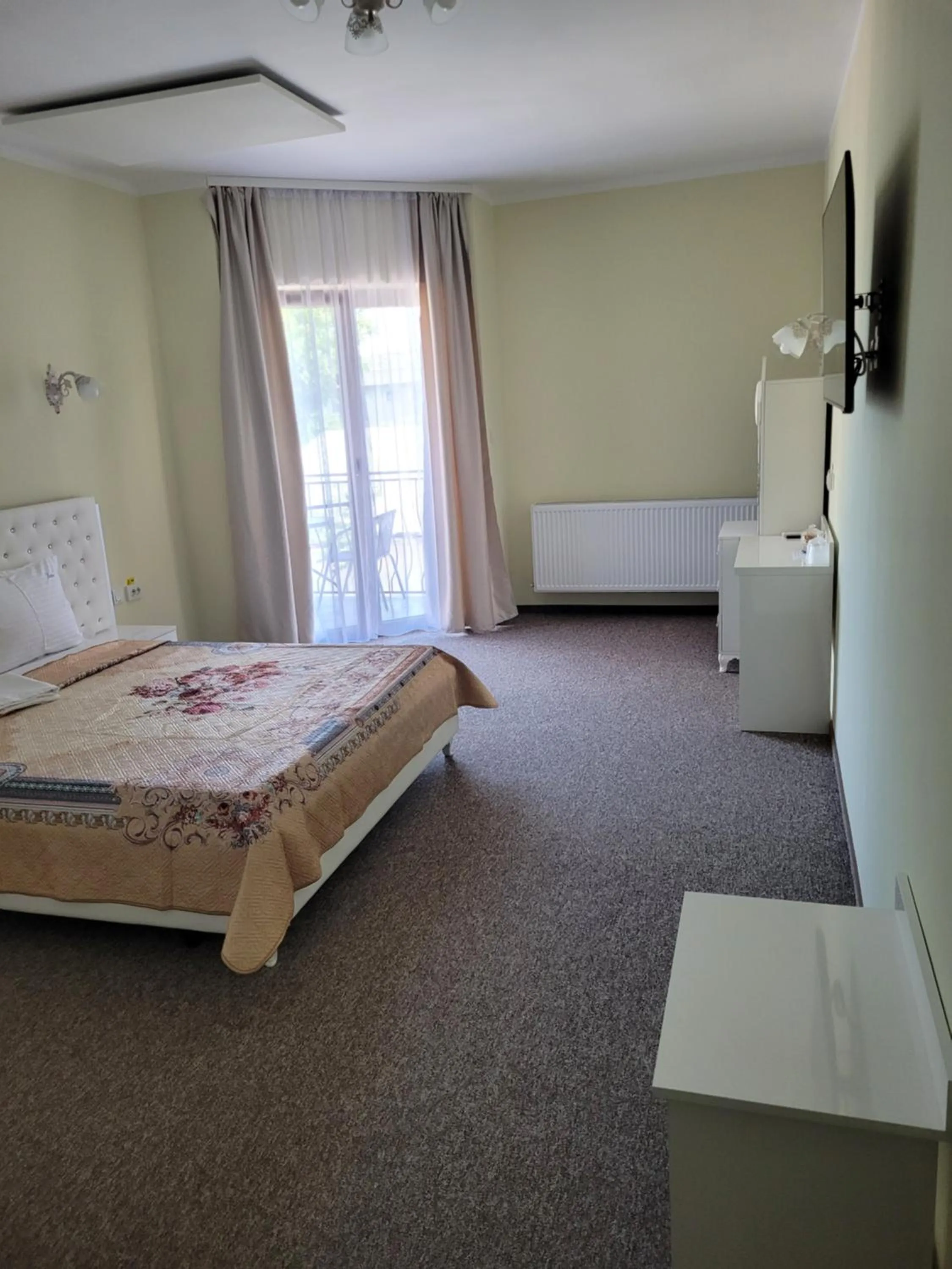 Photo of the whole room, Bed in LOTUS Boutique