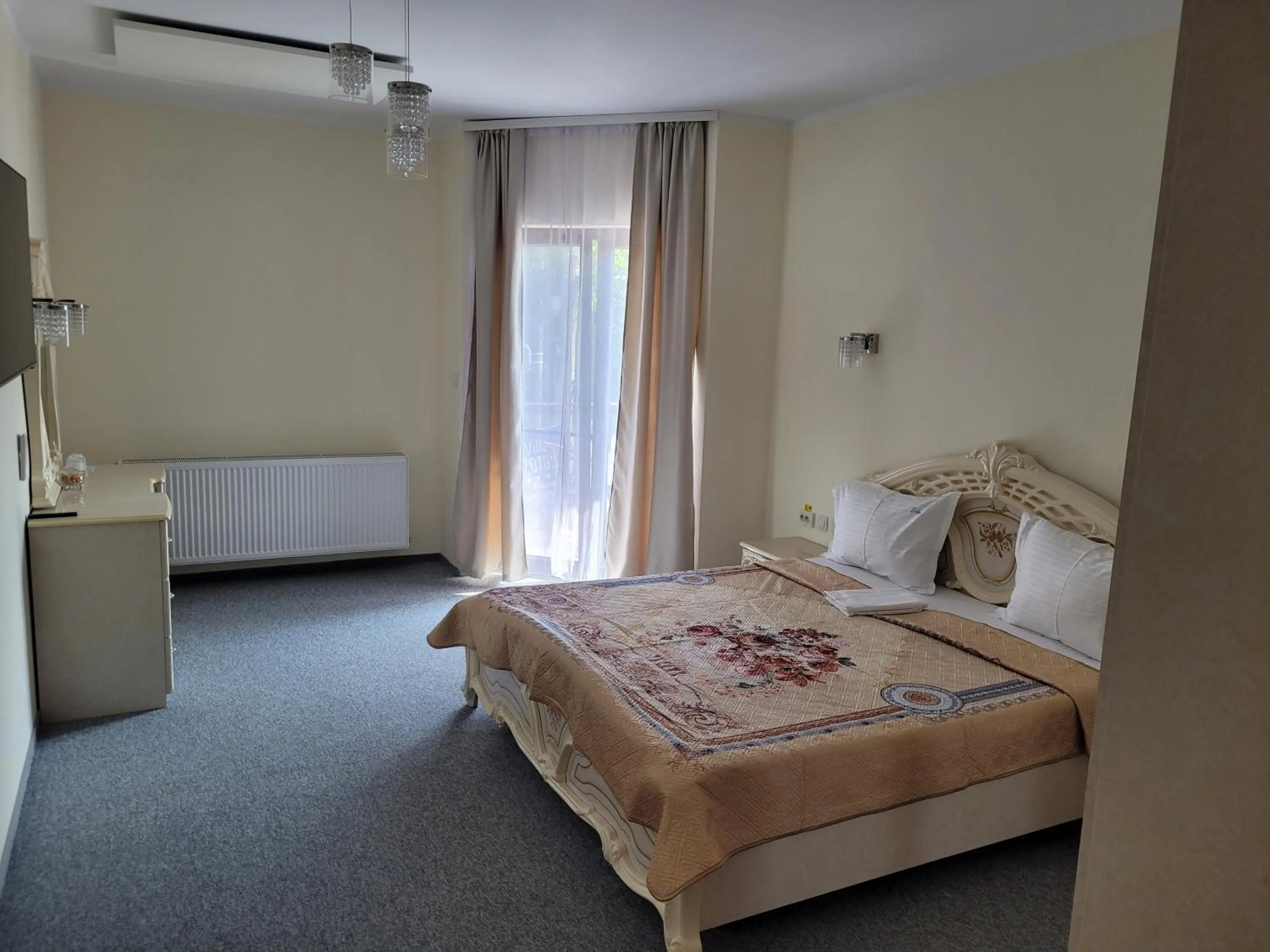 Photo of the whole room, Bed in LOTUS Boutique