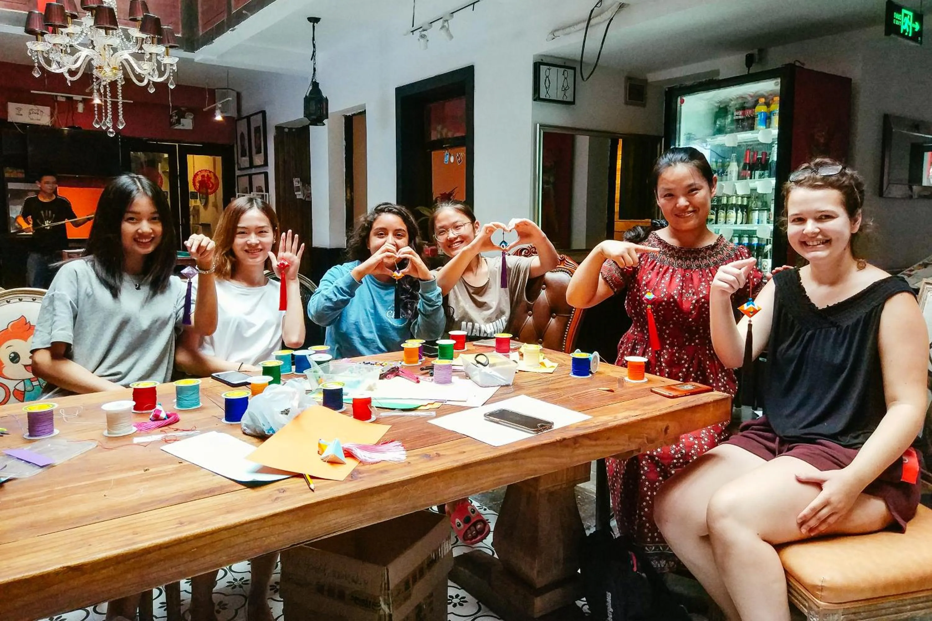 Communal lounge/ TV room in Chengdu Mix Hostel - Next To Wenshu Monastery - Sichuan Style Chill & Social Courtyard House - Free Activities - Friendly English Speaking Staff - Tibet, Panda, Buddha & Snow Mountain Tours