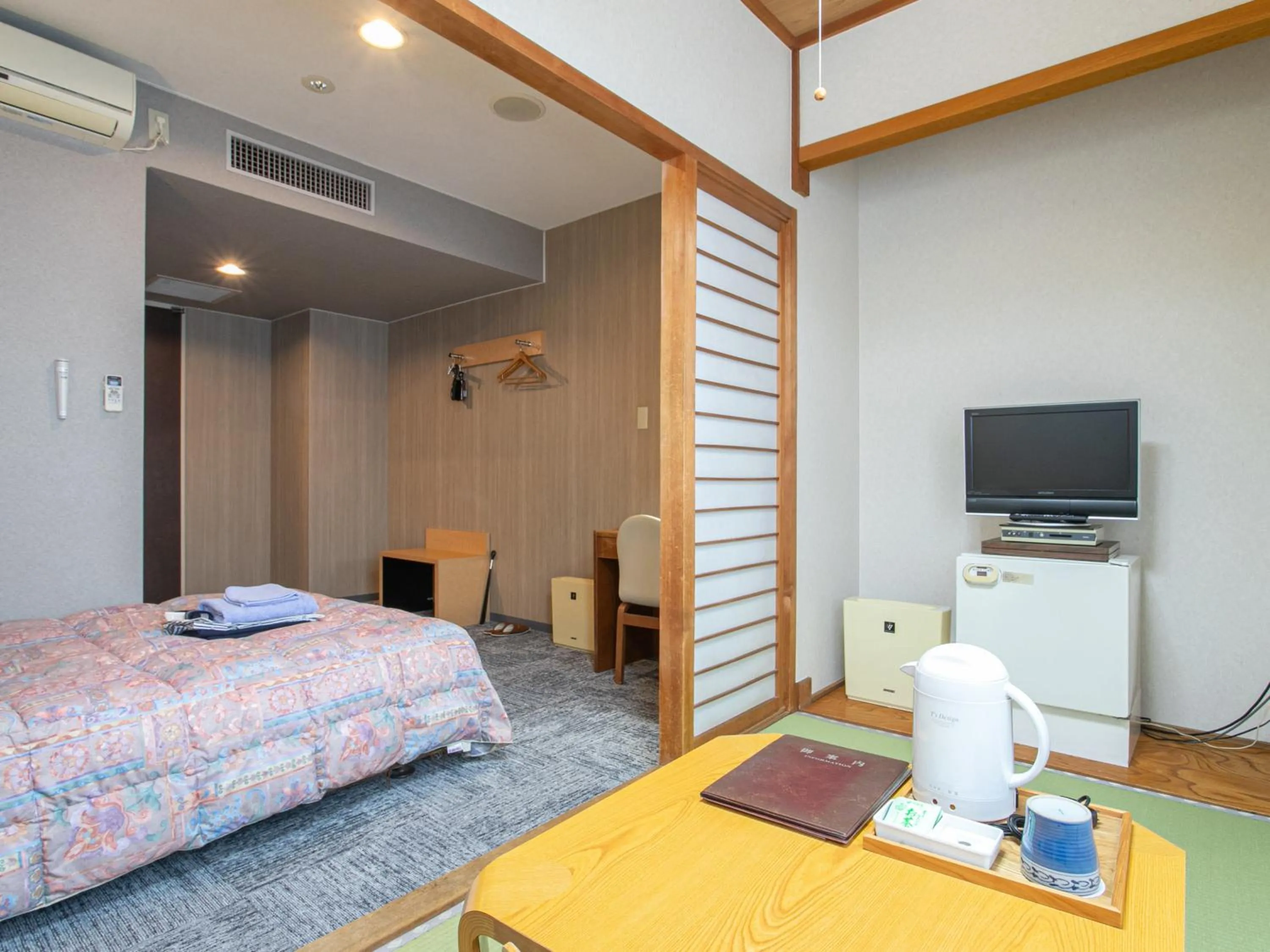 Bed in Aqua Garden Hotel Fukumaru