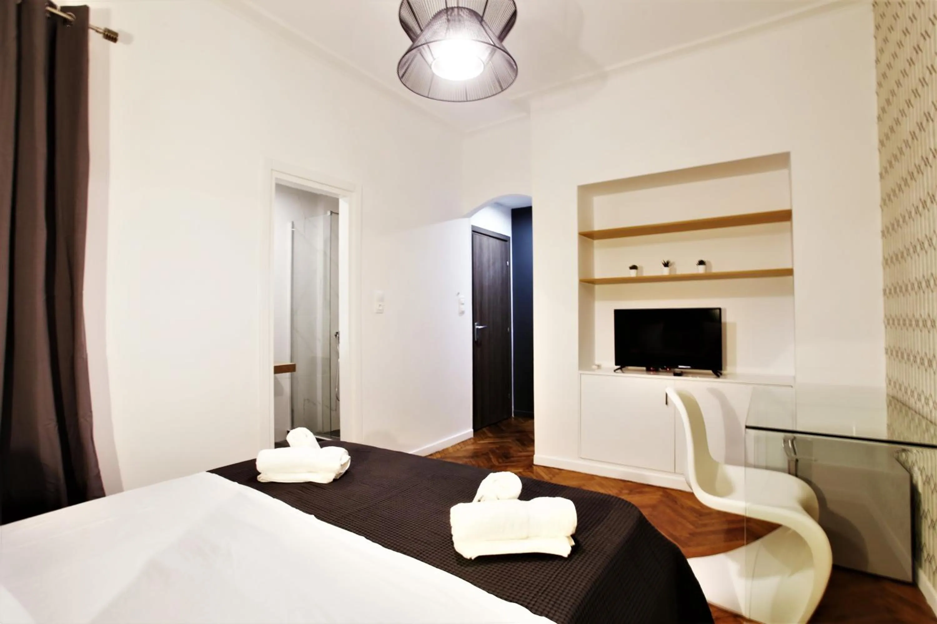 Photo of the whole room, Bed in GK Niki by GK Properties