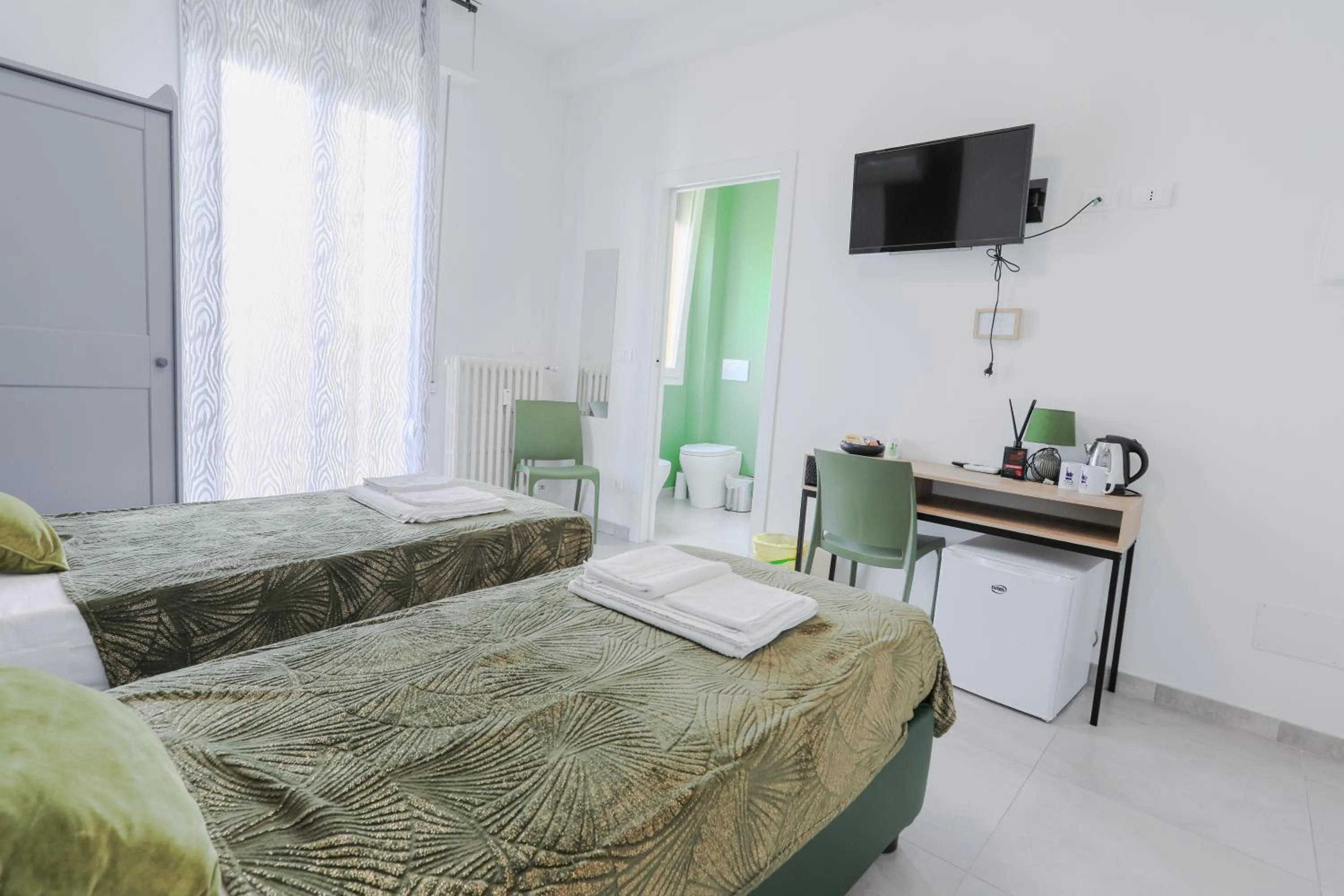 Bed in HOLABOLOGNA Luxury Rooms and Flats