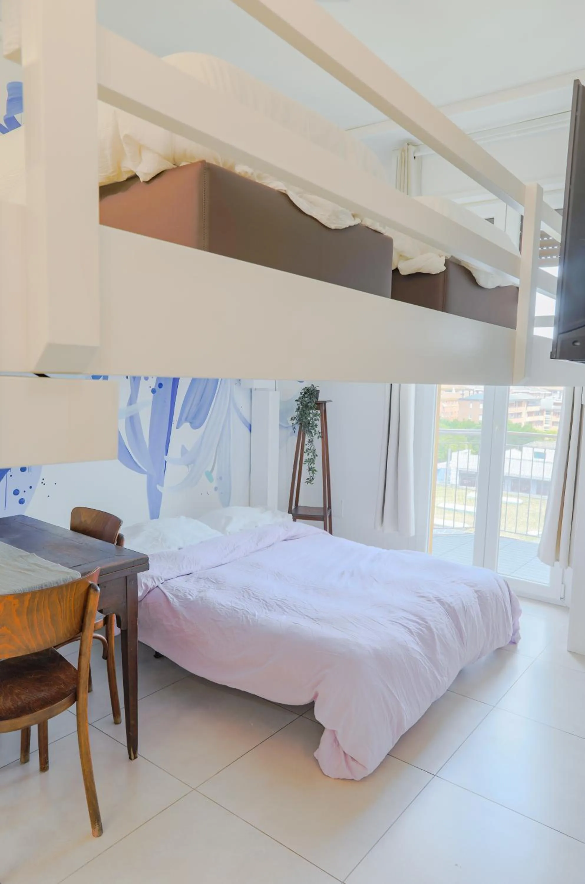 Bed in HOLABOLOGNA Luxury Rooms and Flats