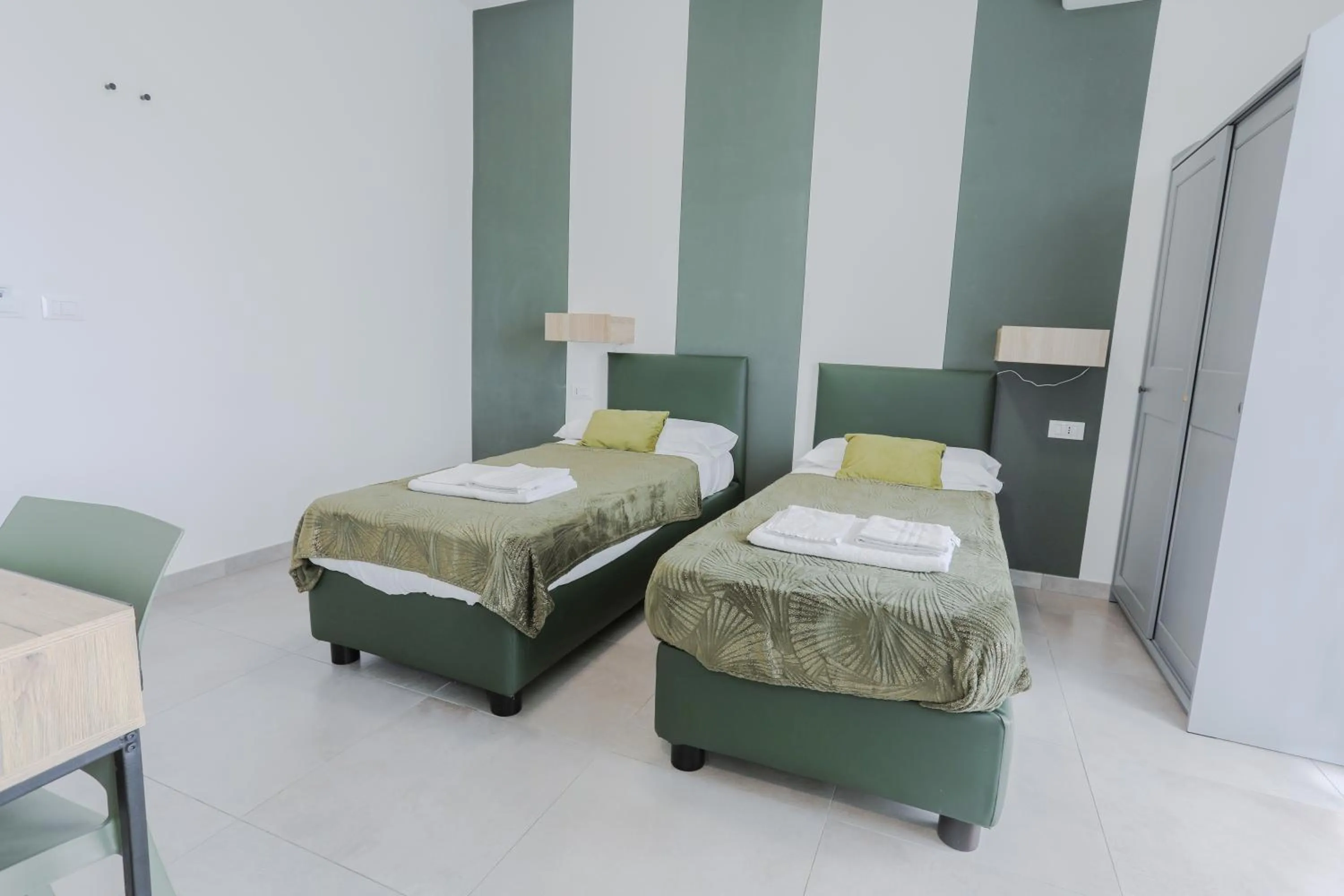 Bed in HOLABOLOGNA Luxury Rooms and Flats