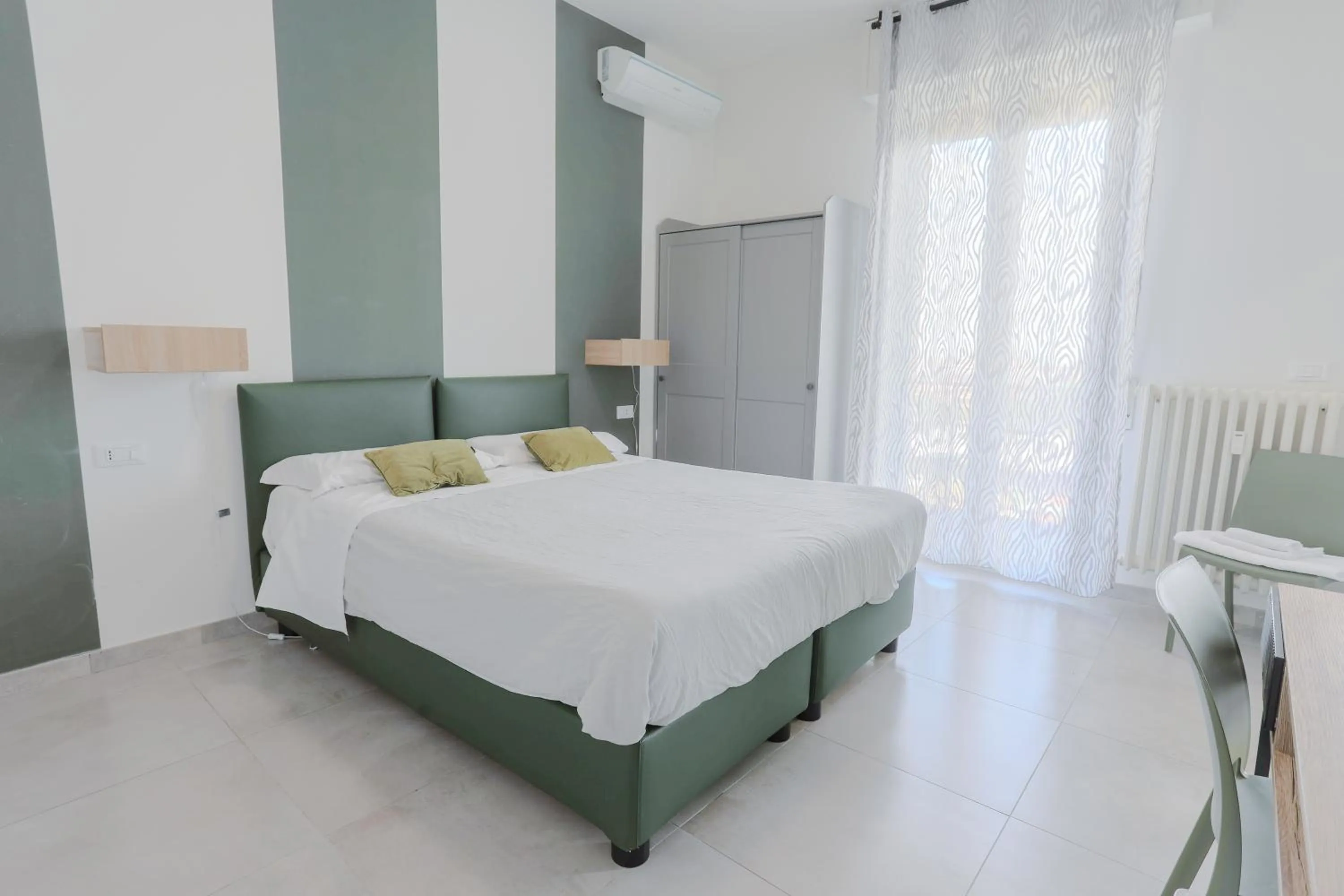 Bed in HOLABOLOGNA Luxury Rooms and Flats