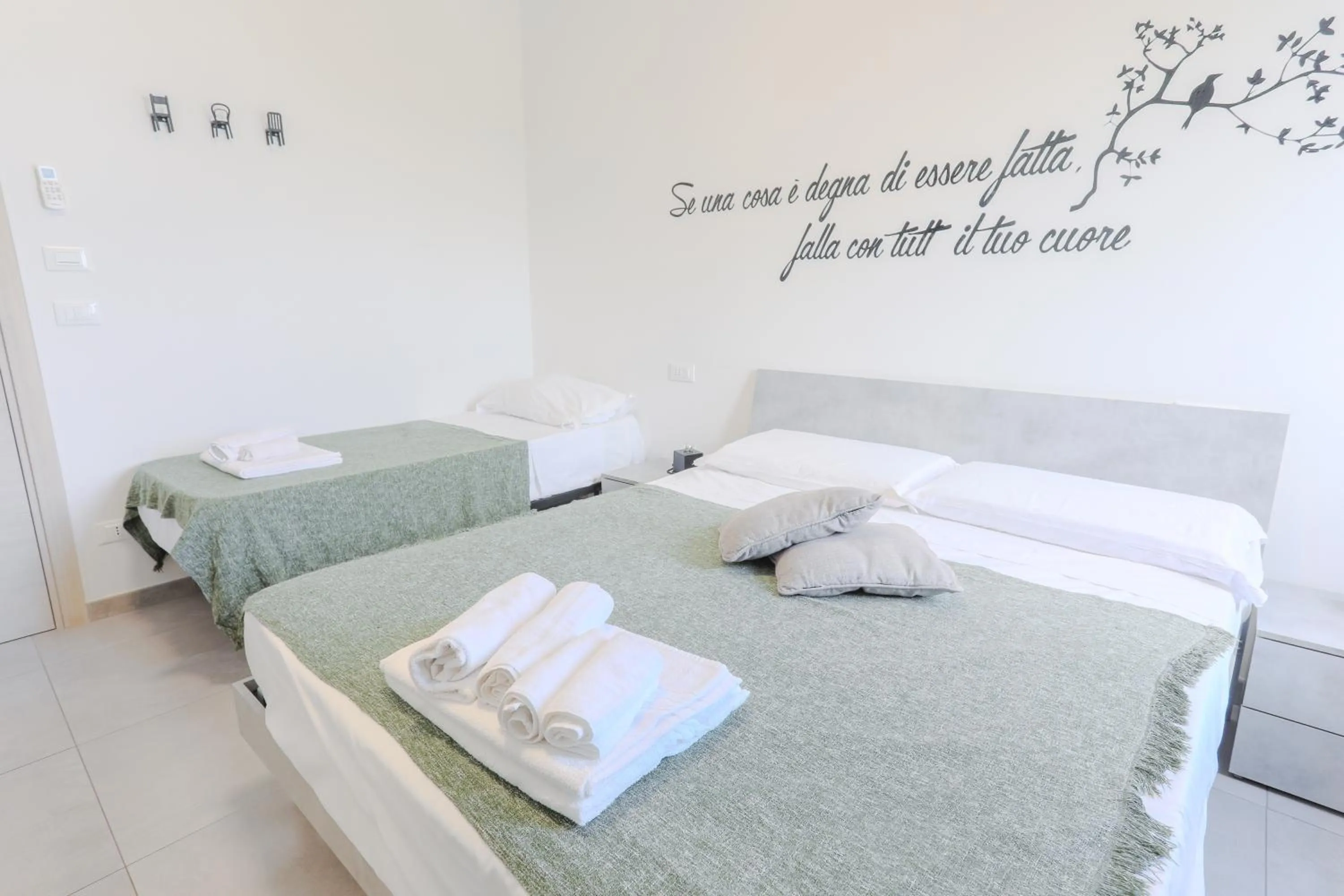 Bed in HOLABOLOGNA Luxury Rooms and Flats