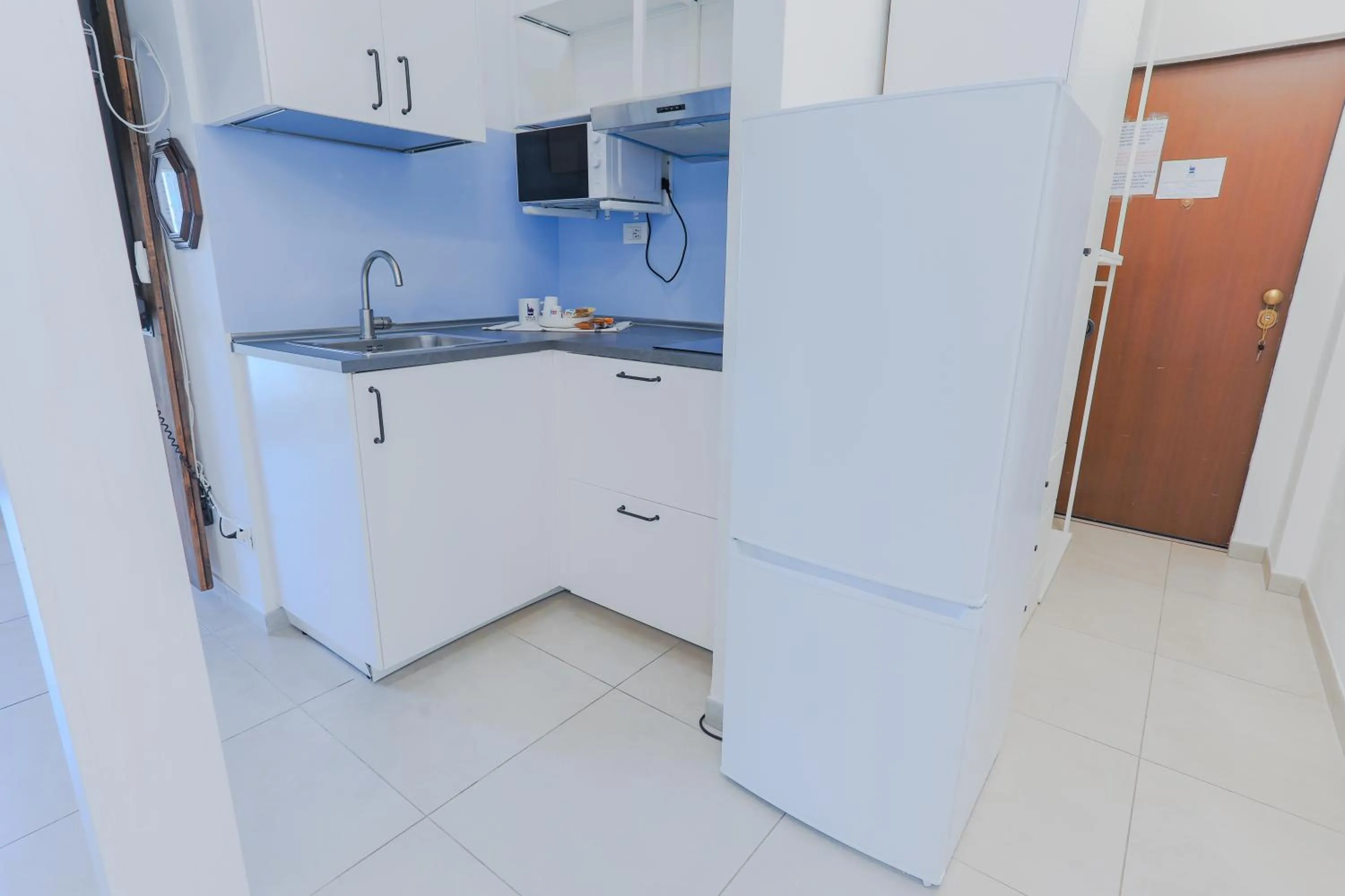 Kitchen or kitchenette in HOLABOLOGNA Luxury Rooms and Flats