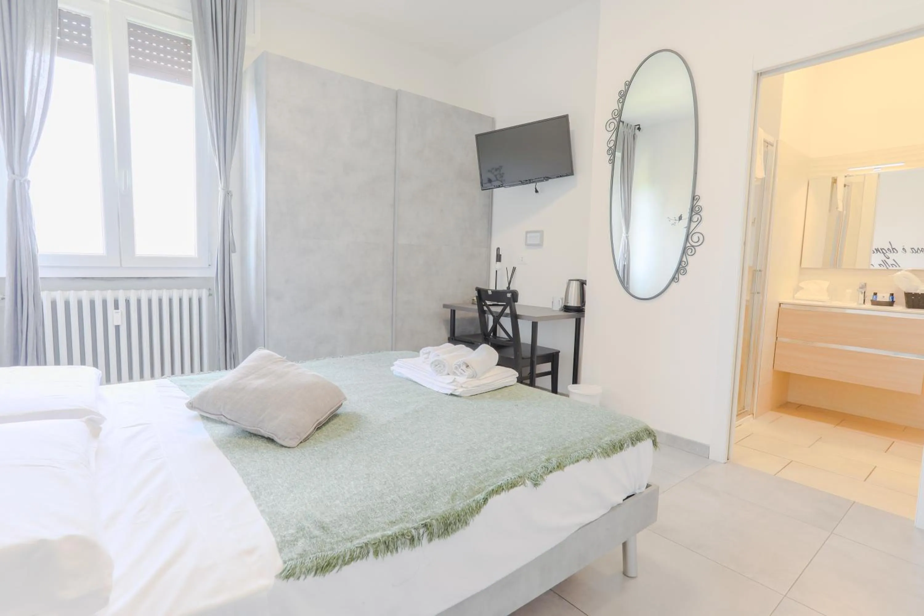 Bed in HOLABOLOGNA Luxury Rooms and Flats