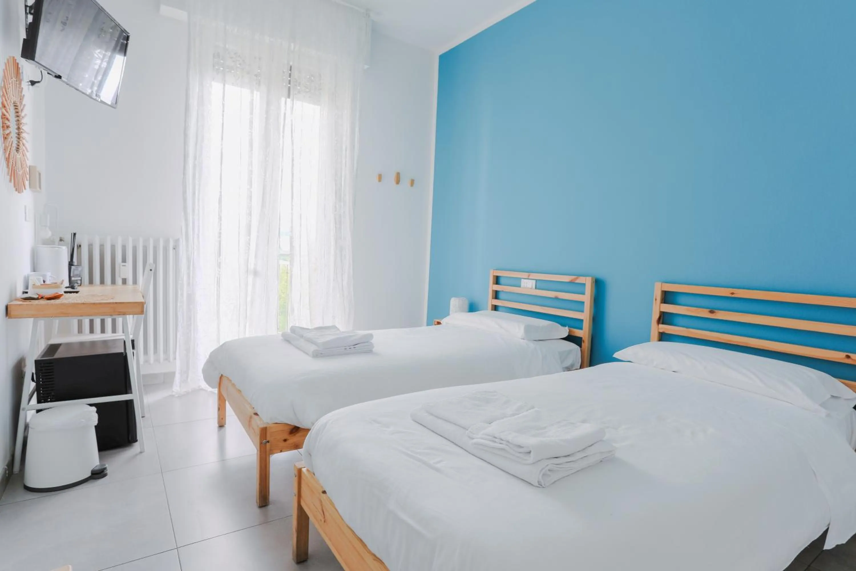 Bed in HOLABOLOGNA Luxury Rooms and Flats