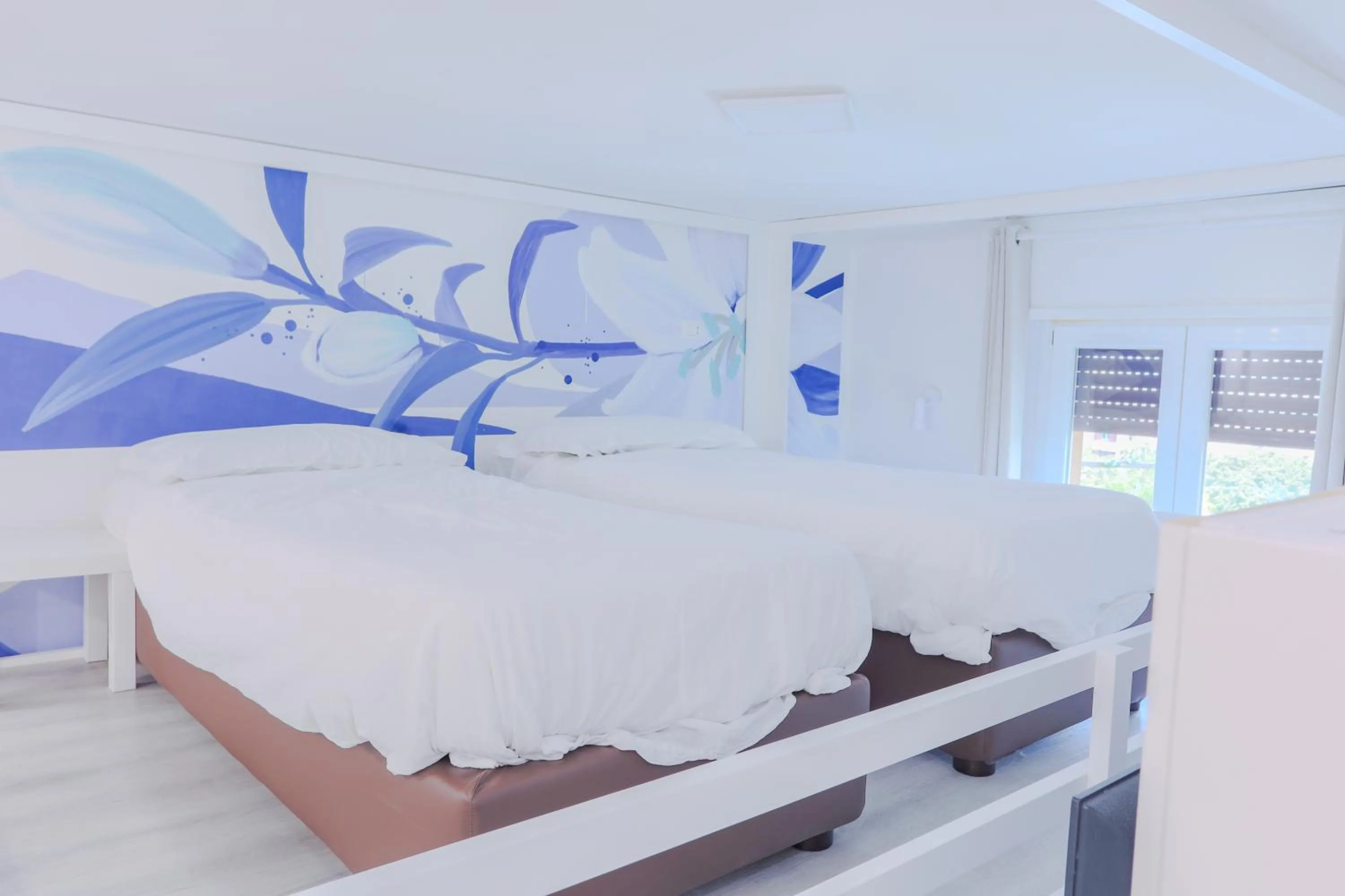 Bed in HOLABOLOGNA Luxury Rooms and Flats