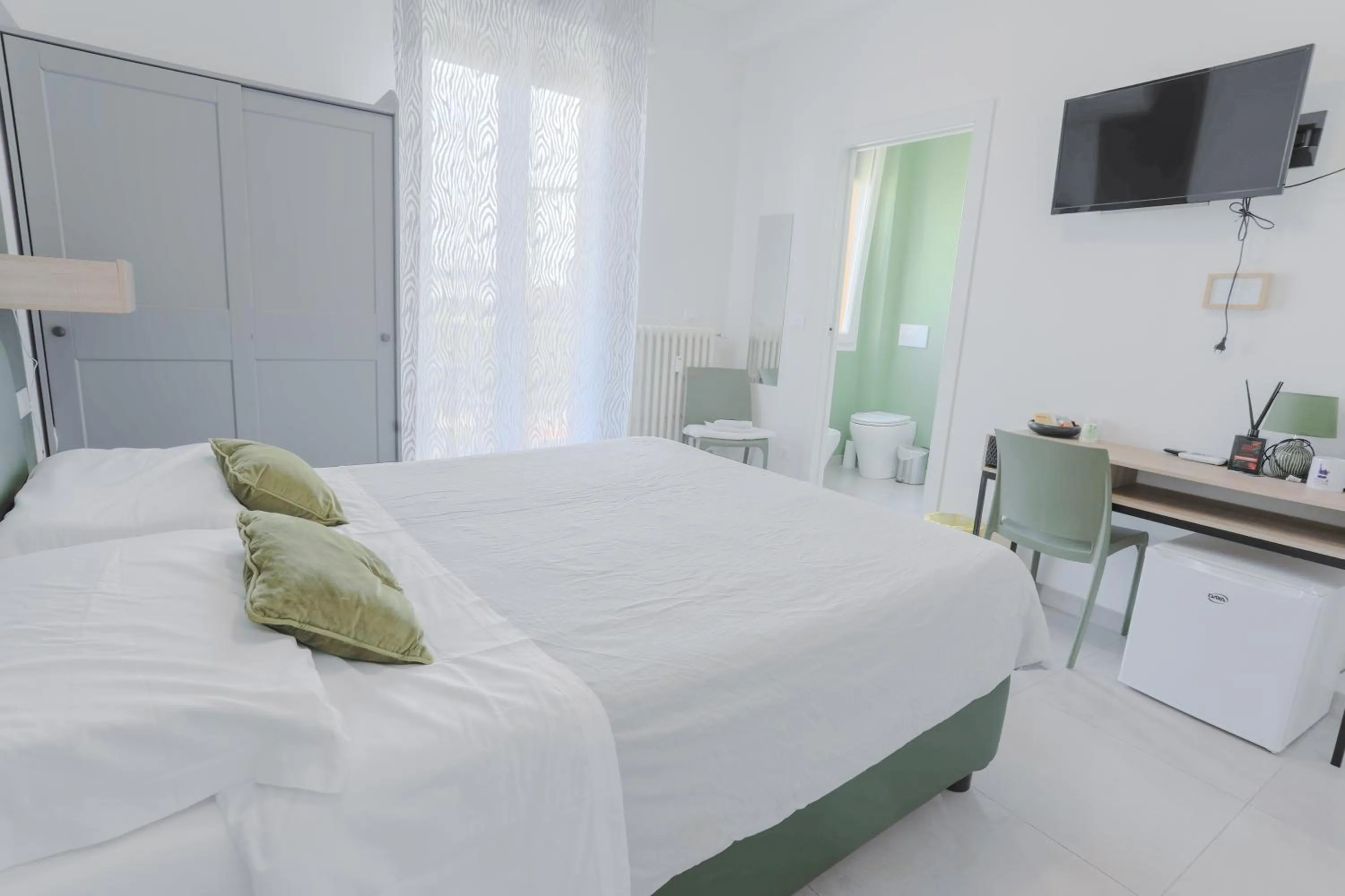 Bed in HOLABOLOGNA Luxury Rooms and Flats