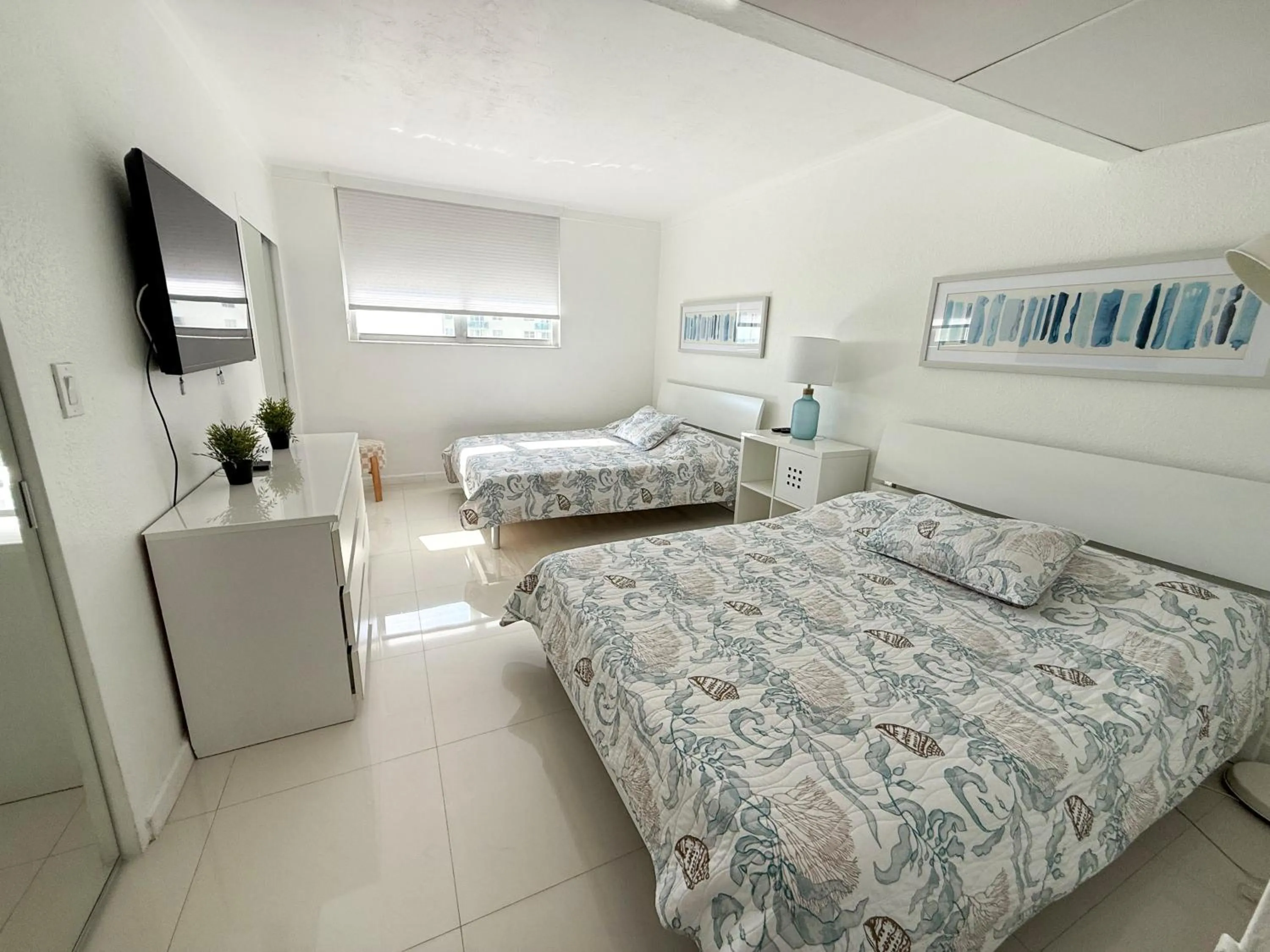 Bedroom, Bed in The Tides Apartments on the beach