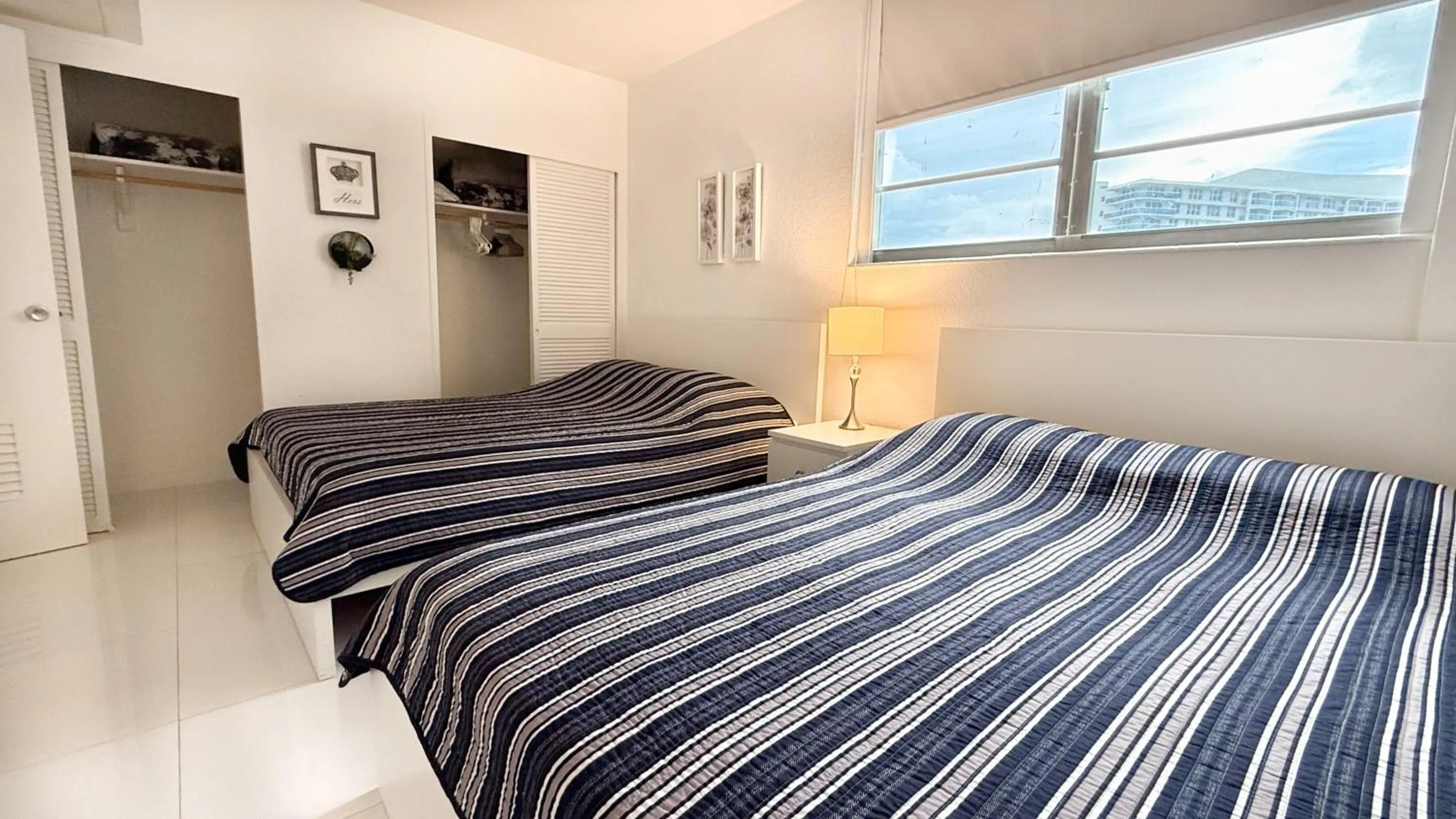 Bedroom, Bed in The Tides Apartments on the beach