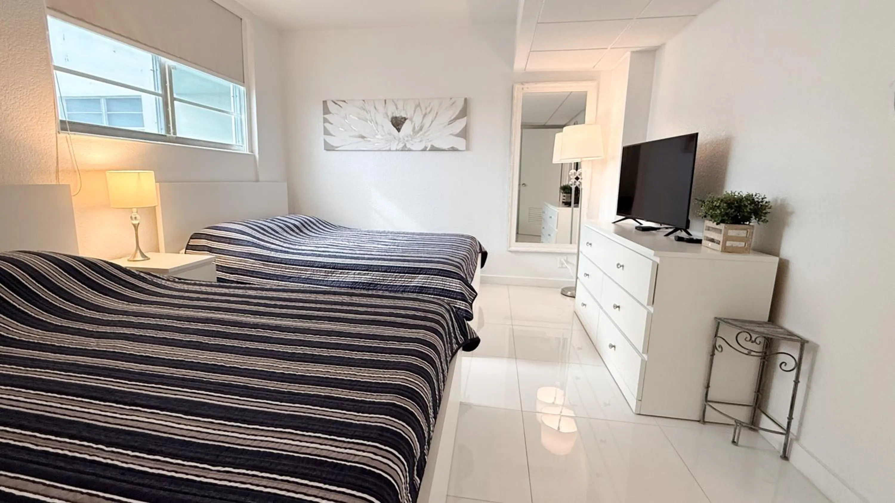 Bedroom, Bed in The Tides Apartments on the beach