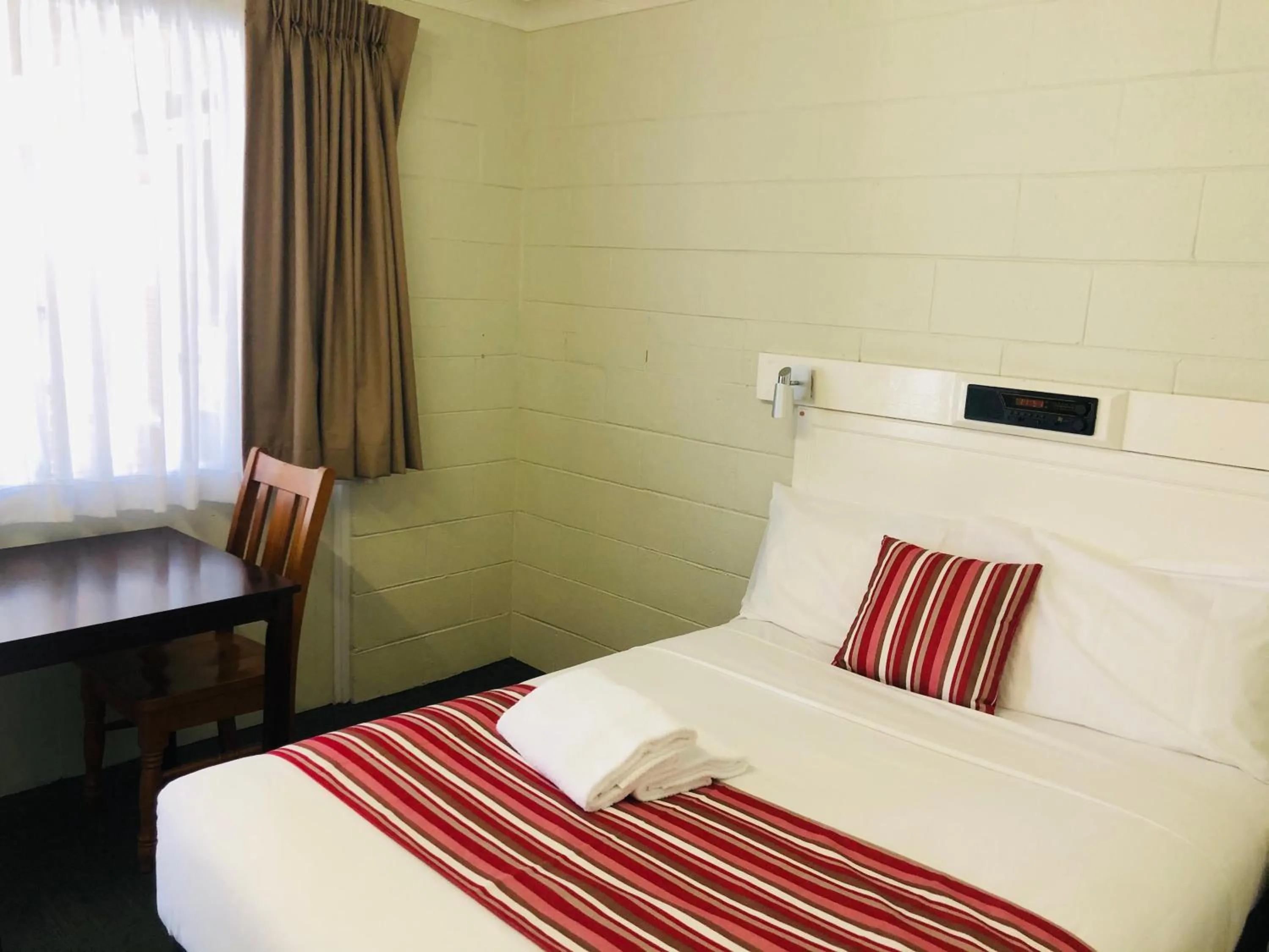 Bed in Central Coast Motel