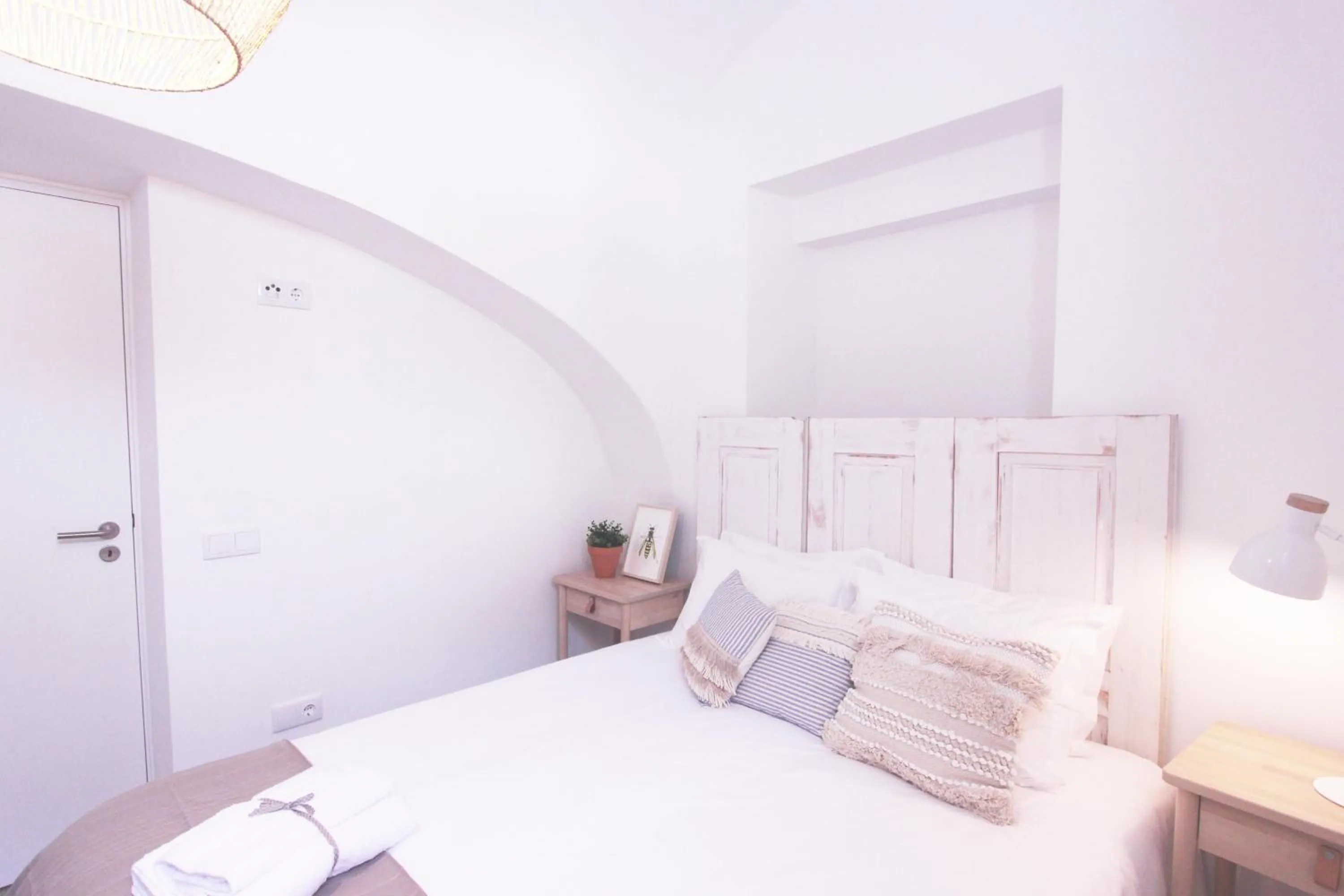 Bed in Lavradores Boutique Guesthouse