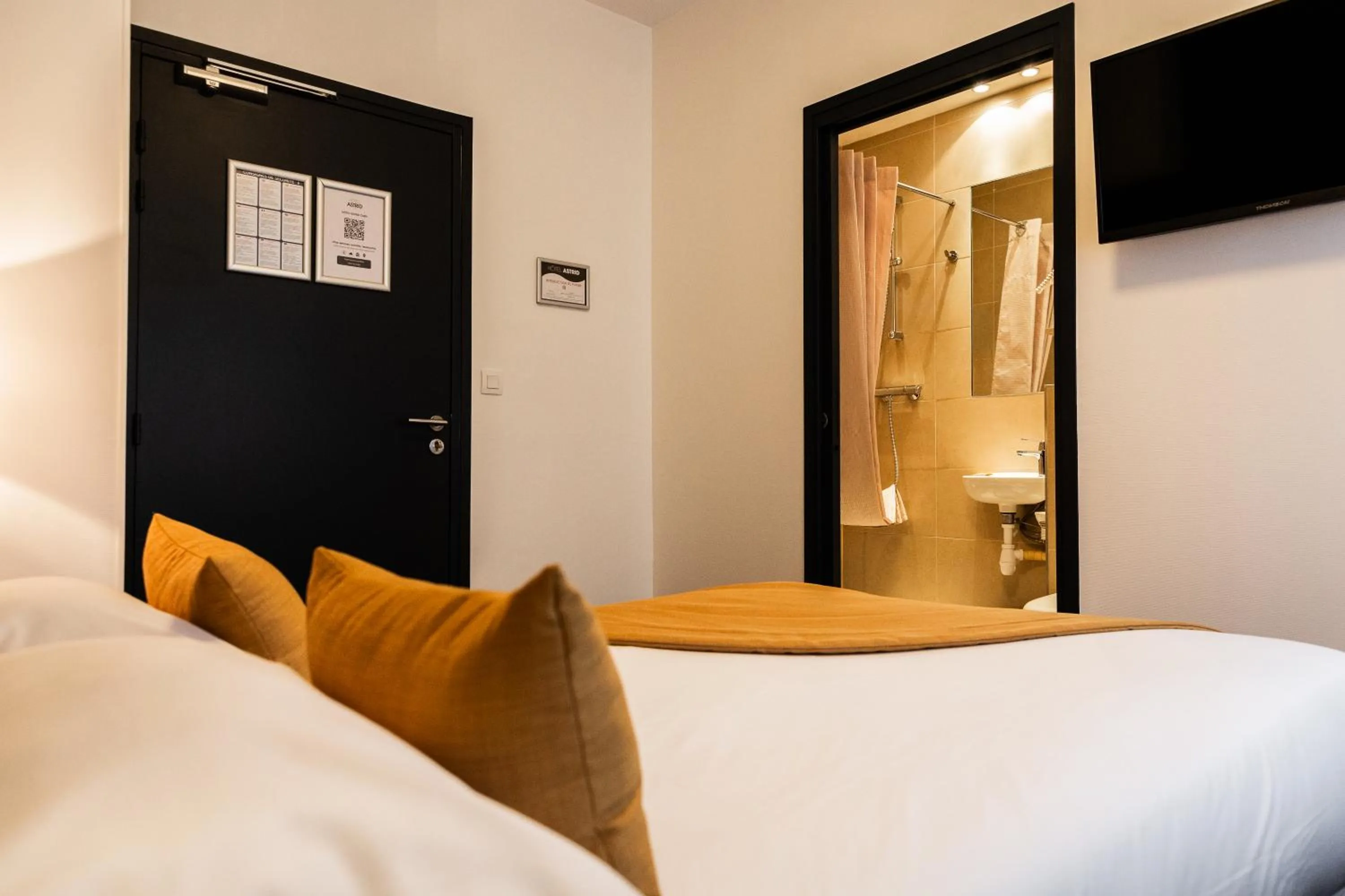 Photo of the whole room, Bed in Hotel Astrid Caen centre