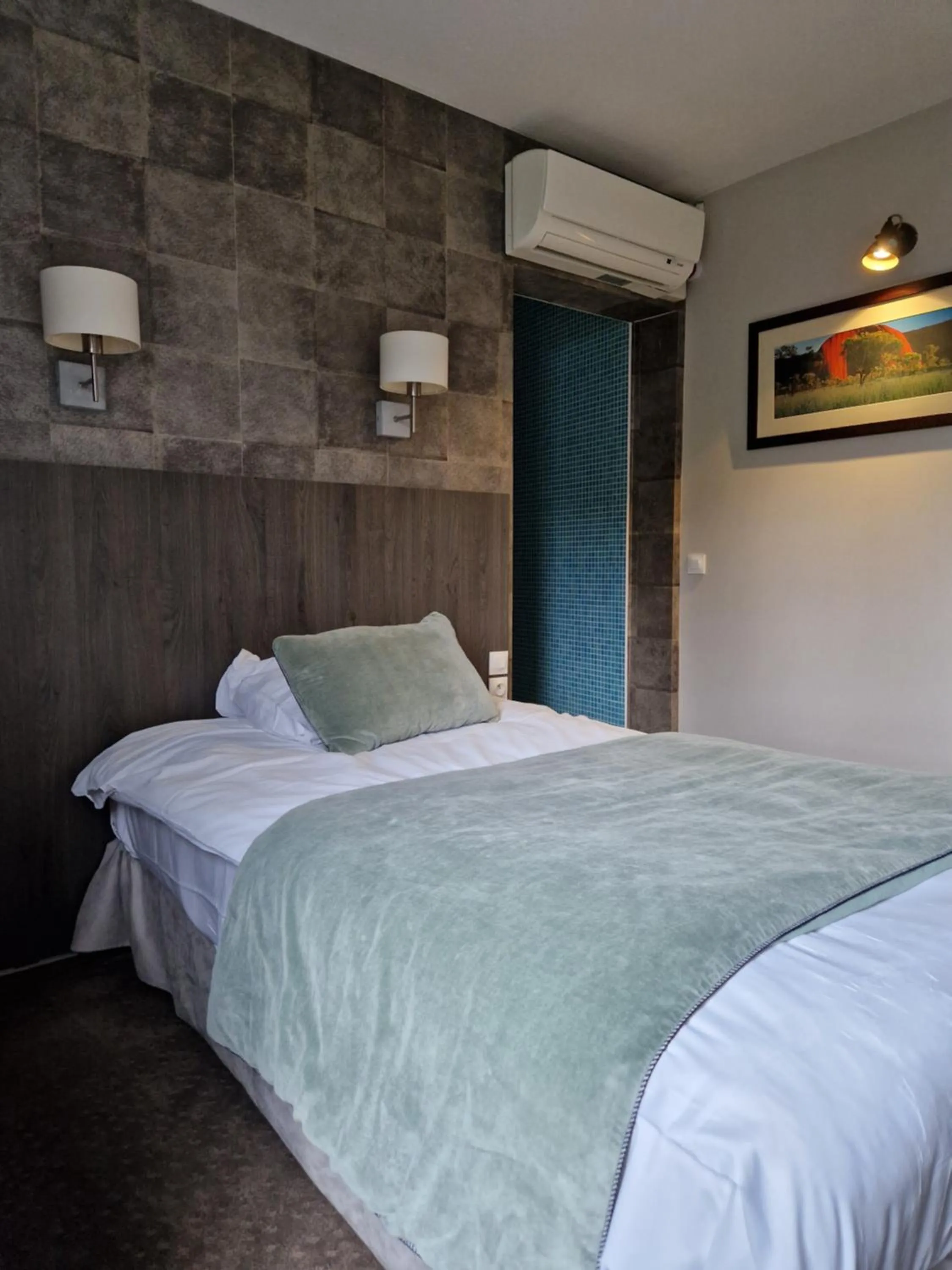 Bed in Hotel Acadie Les Ulis