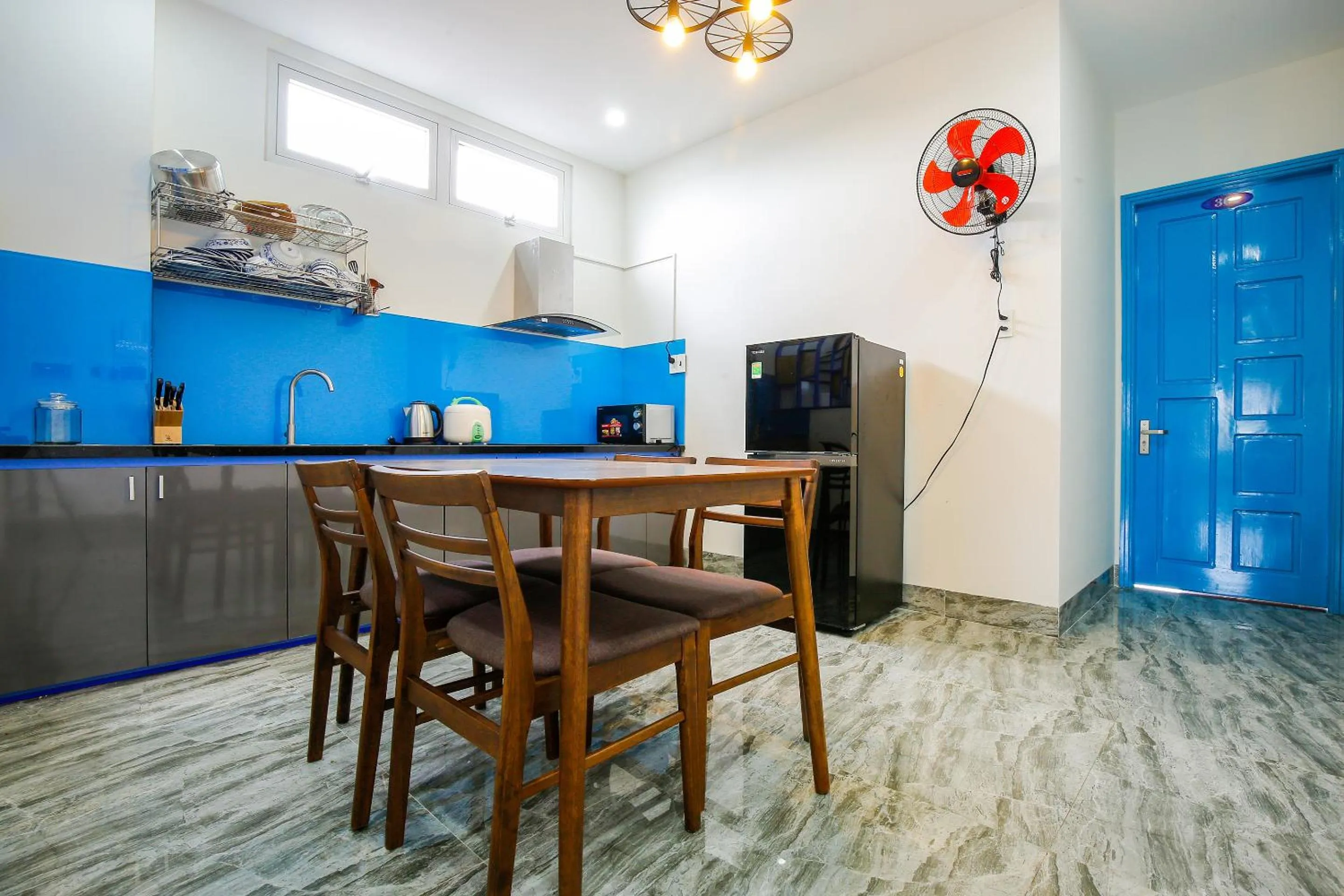 Kitchen or kitchenette in Santorini House and Coffee