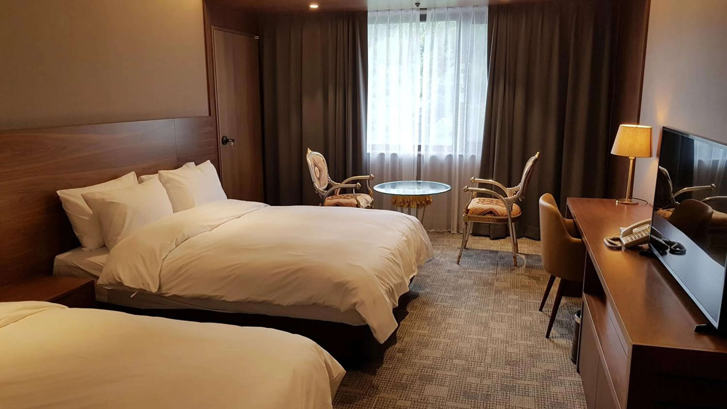 Bed in Mudeung Park Hotel