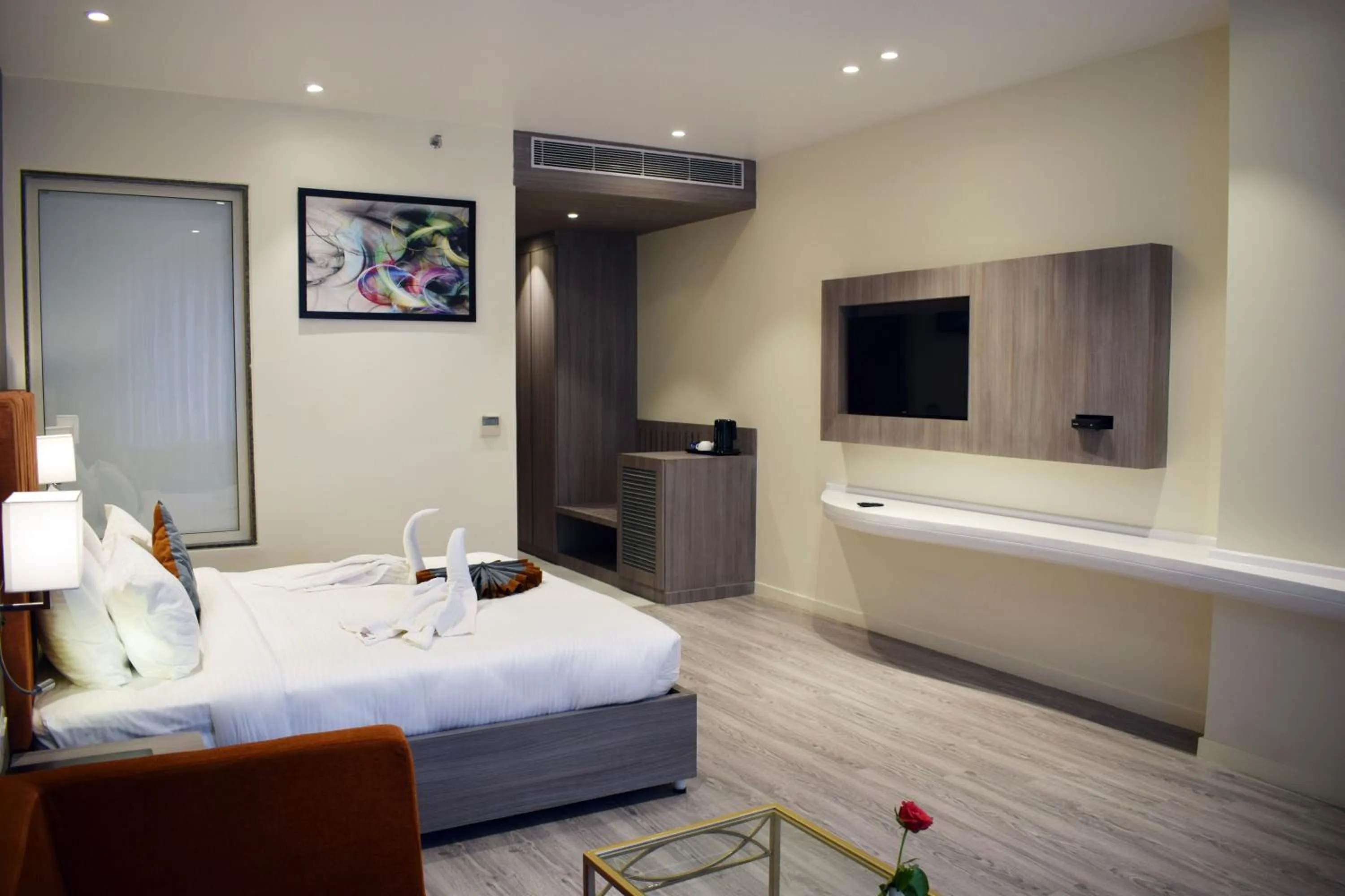 Communal lounge/ TV room, Bed in Hotel Deep Clarks Inn Lucknow