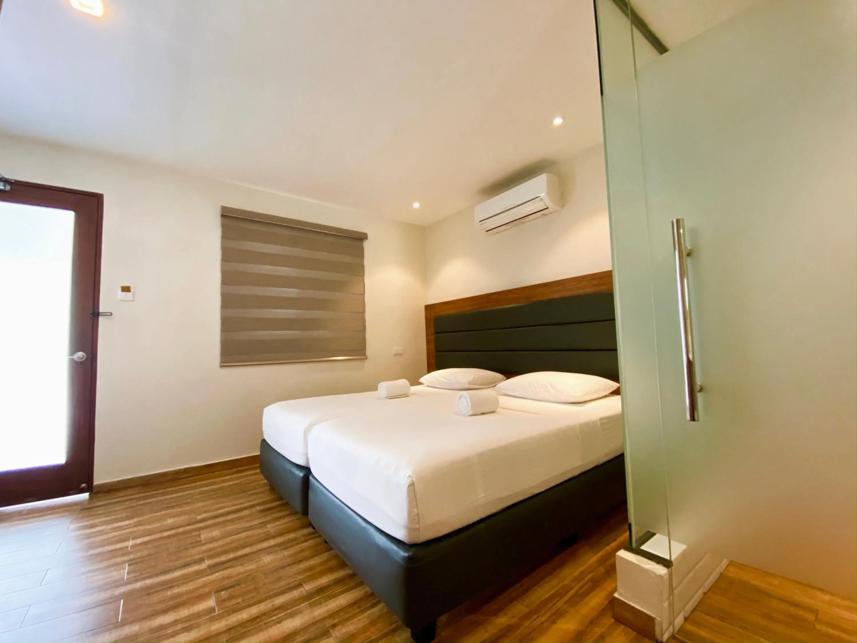 Bed in The Hub District Garden Suites