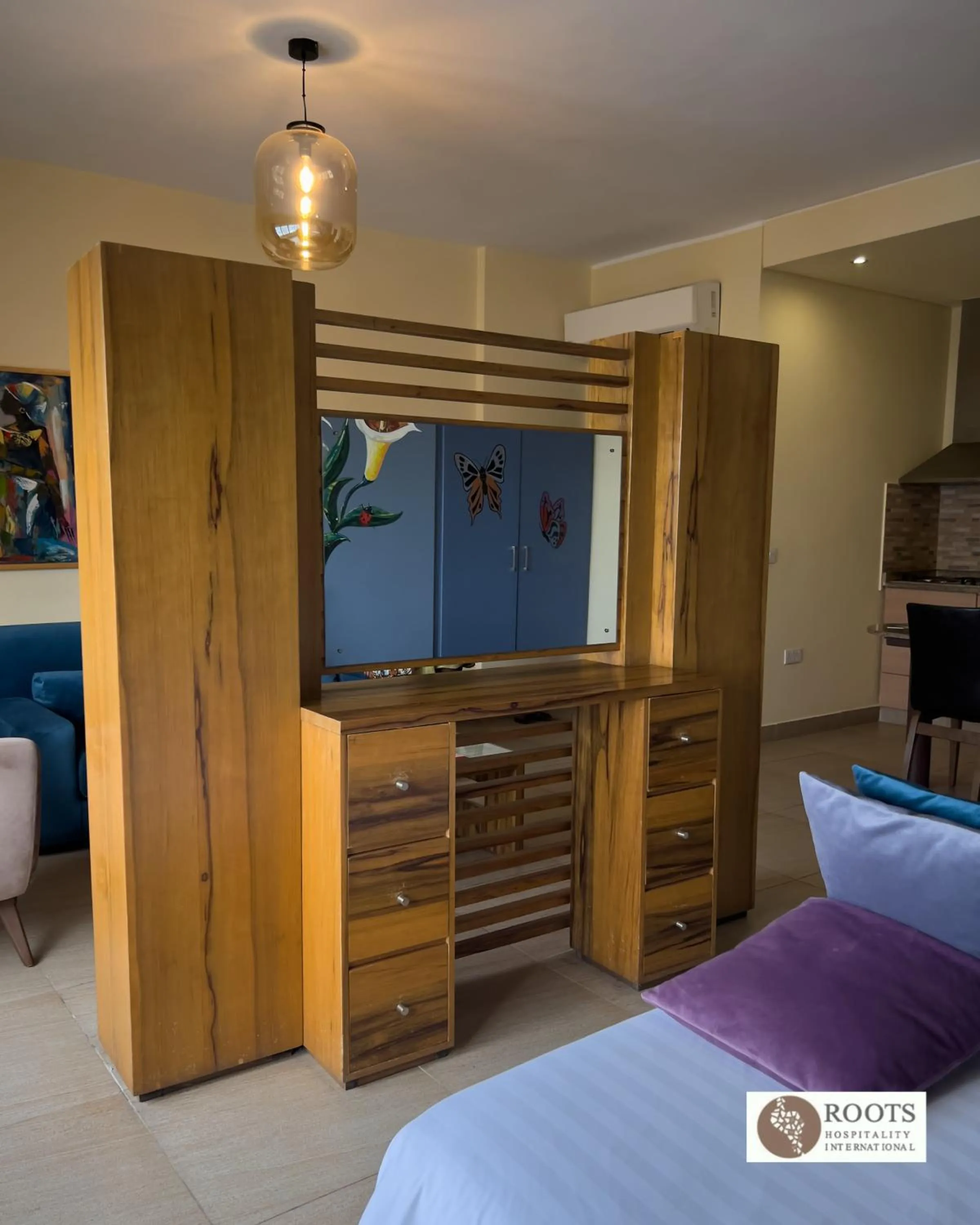 Bed in Roots Hotel Apartment