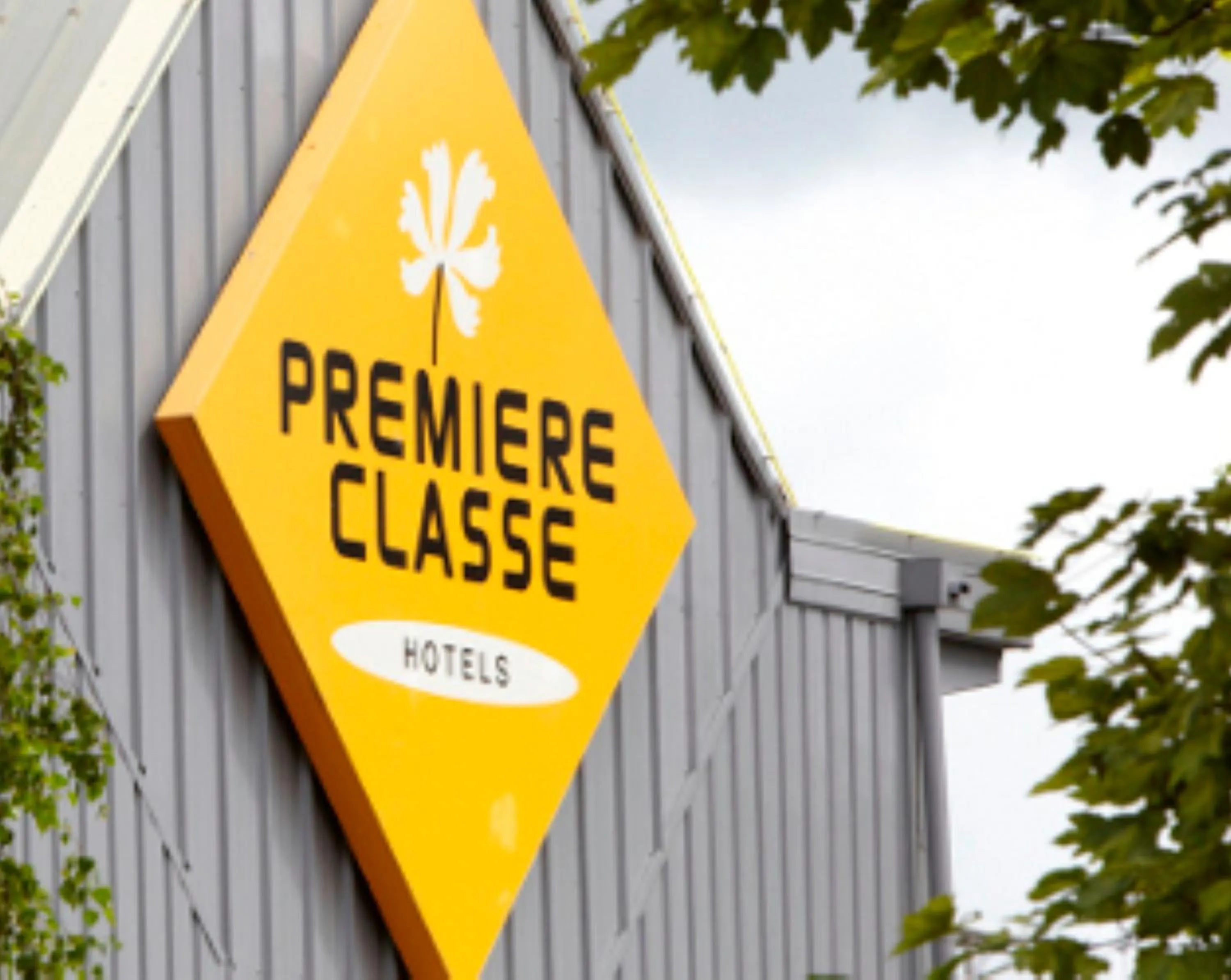Property logo or sign in Premiere Classe Valenciennes Ouest Petite Foret