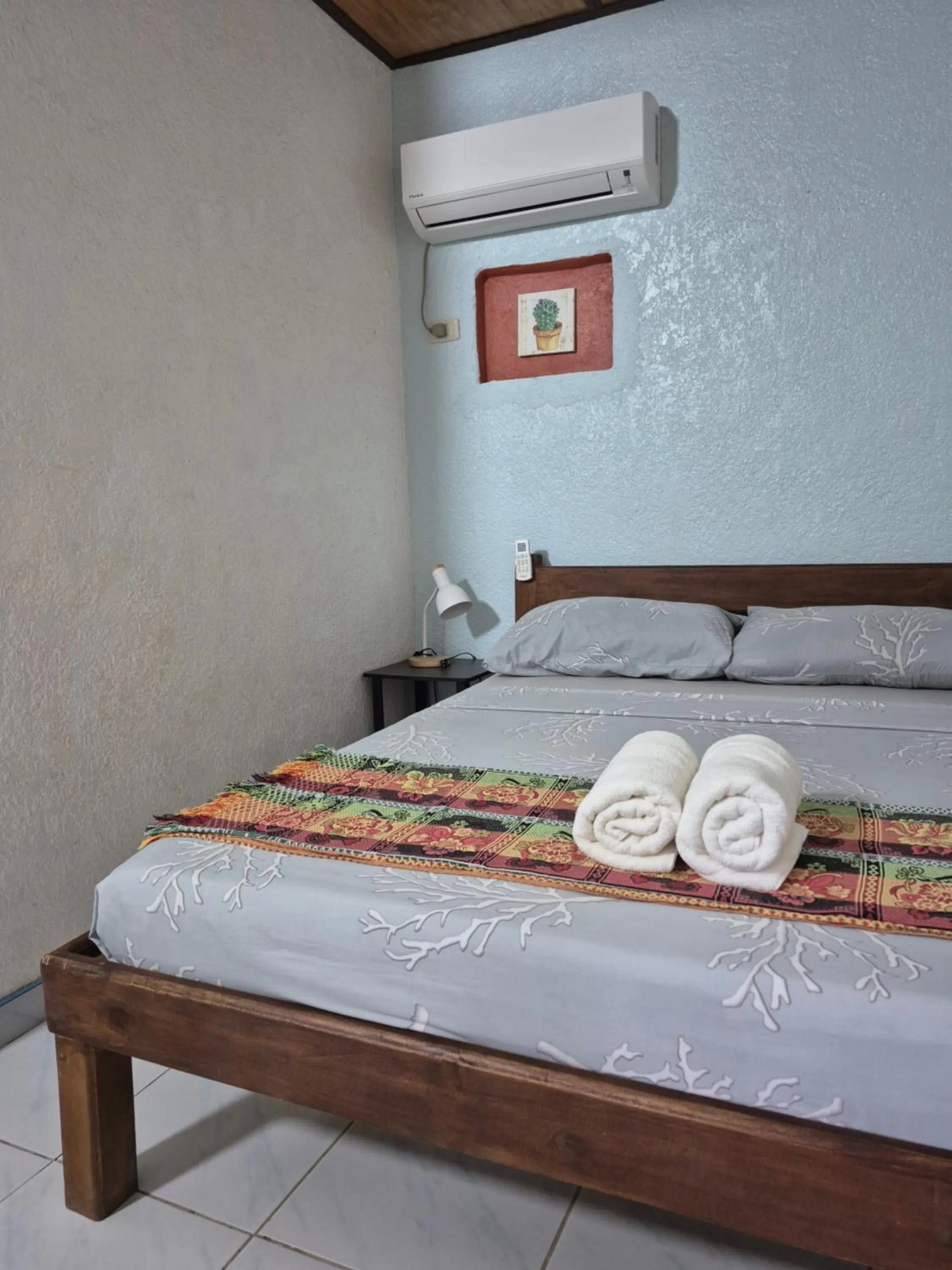 Bed in ALONALAND RESORT