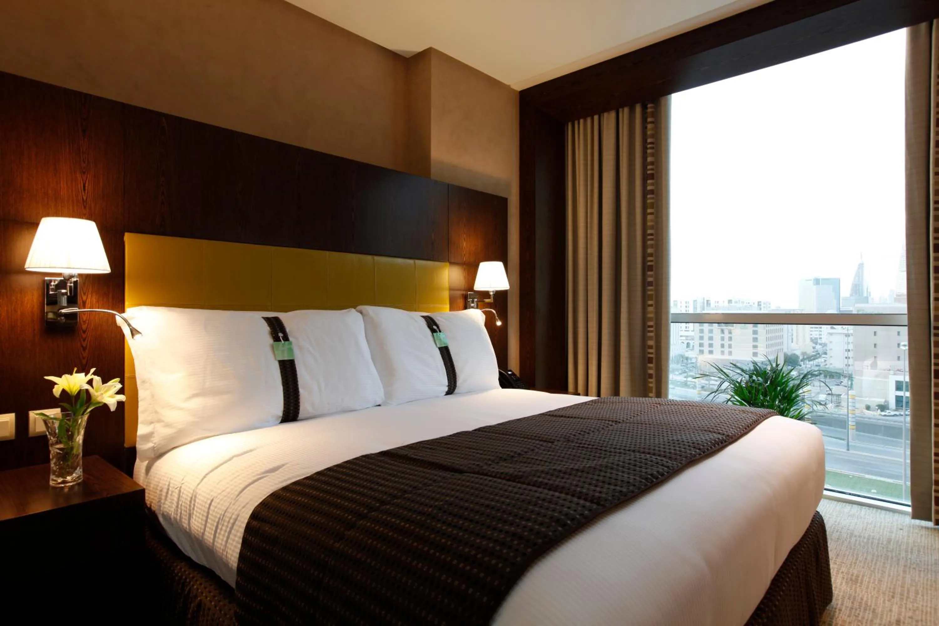 Bed in Holiday Inn Meydan, an IHG Hotel