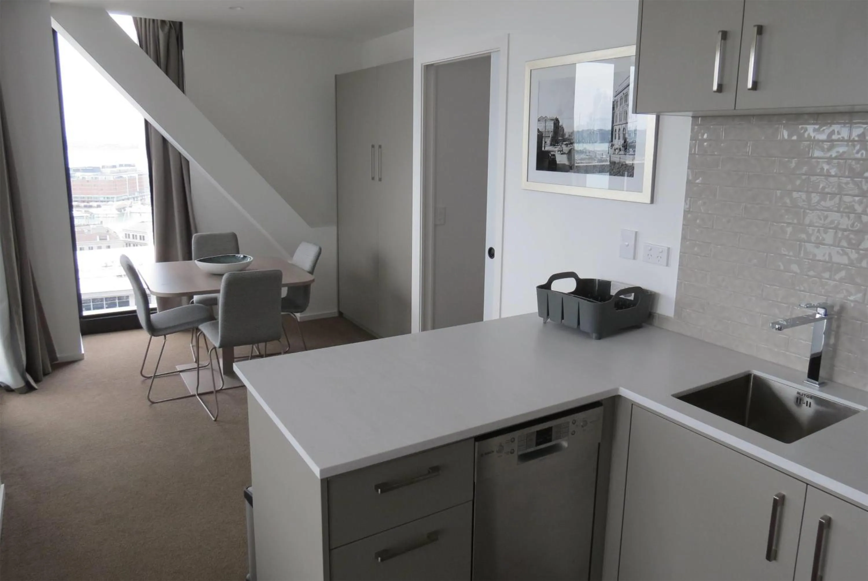 Kitchen or kitchenette in Ramada Suites By Wyndham Victoria Street West