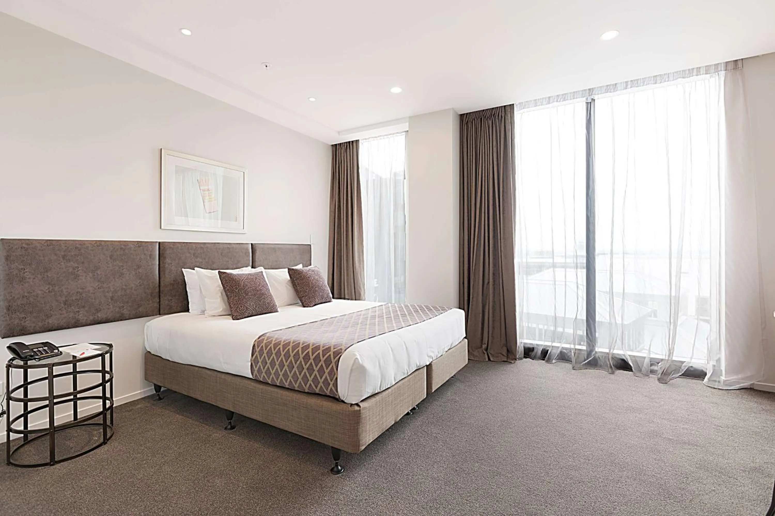 Photo of the whole room, Bed in Ramada Suites By Wyndham Victoria Street West