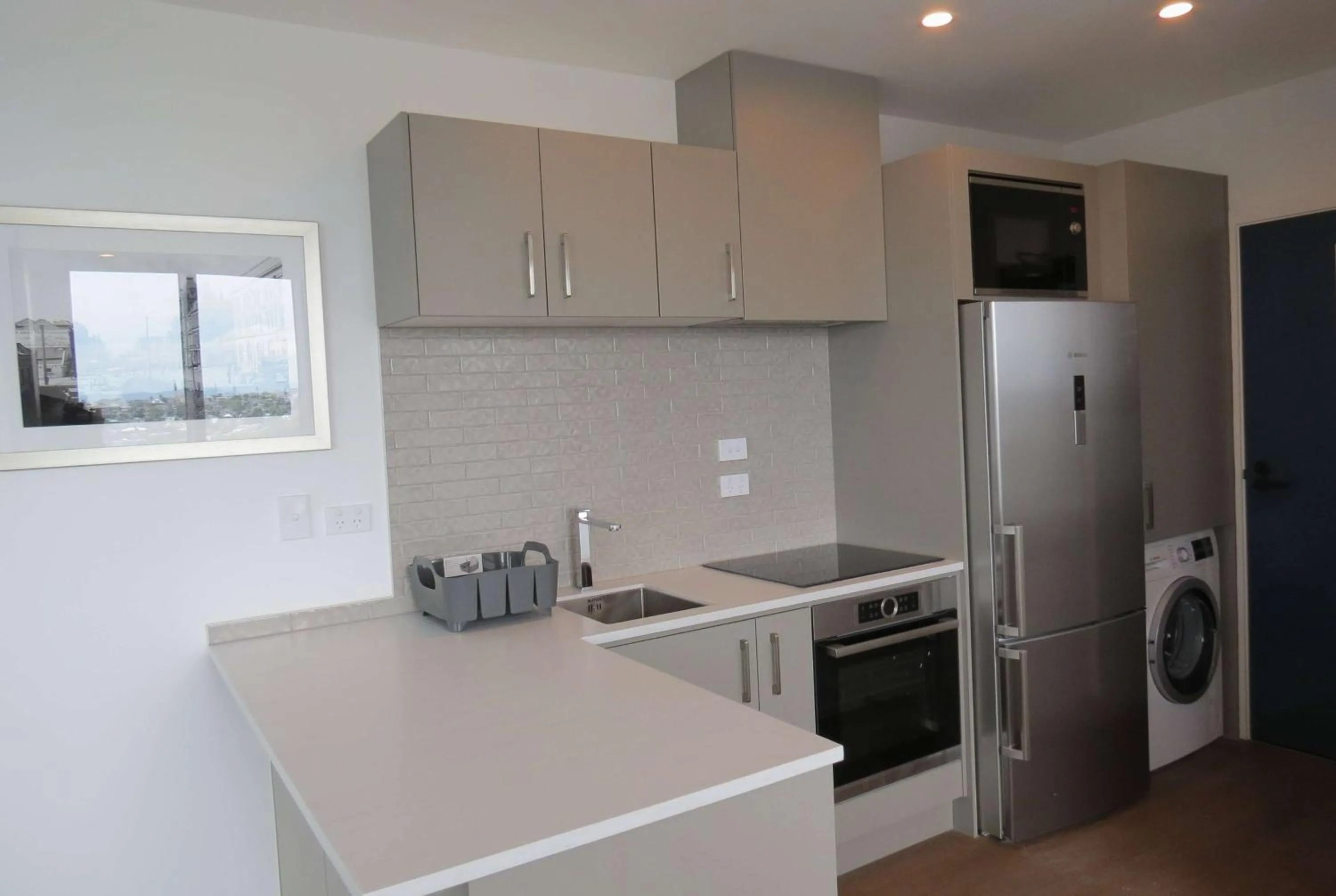 Kitchen or kitchenette in Ramada Suites By Wyndham Victoria Street West