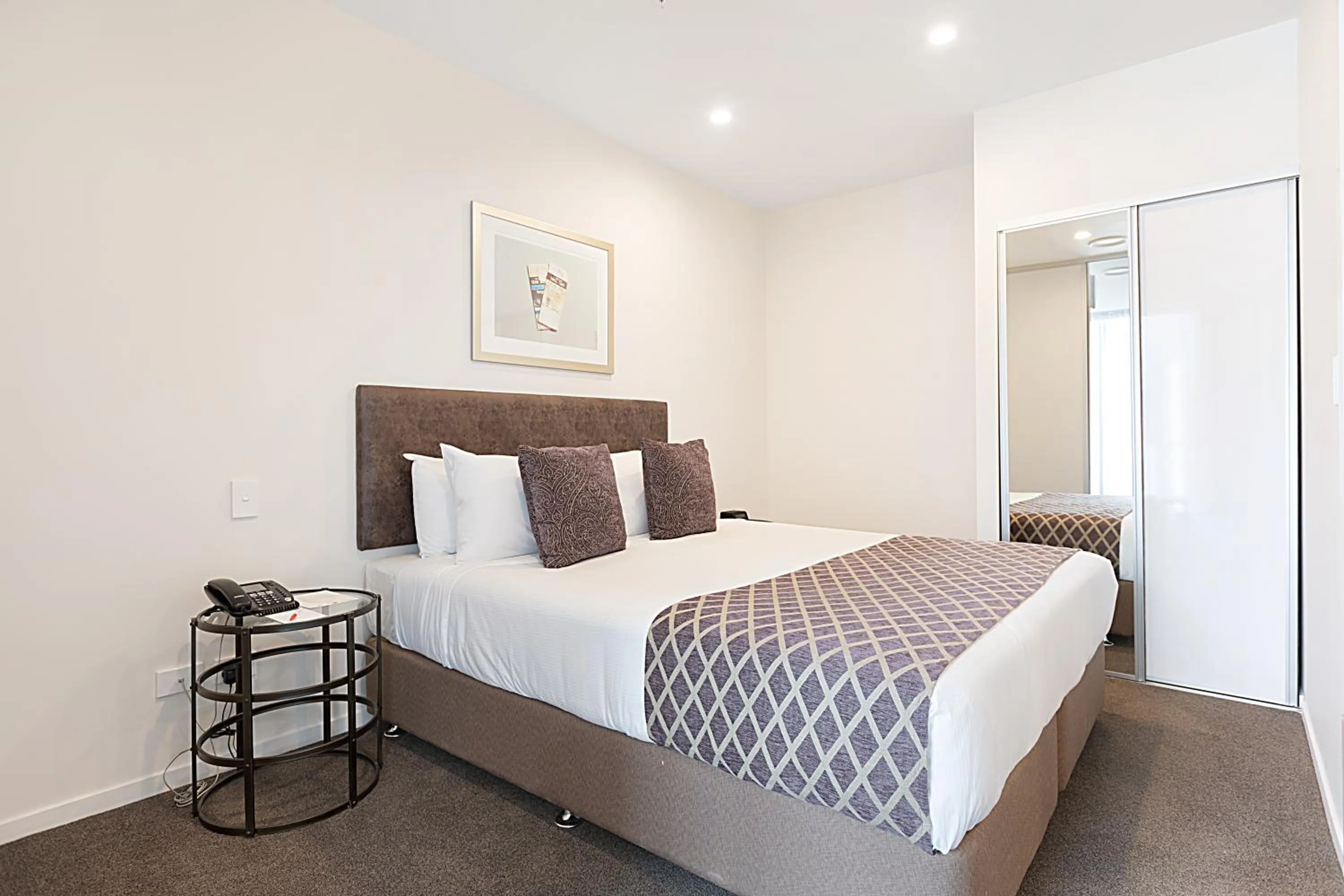 Bed in Ramada Suites By Wyndham Victoria Street West