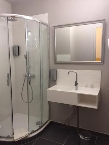 Bathroom in Logis Hotel du Midi